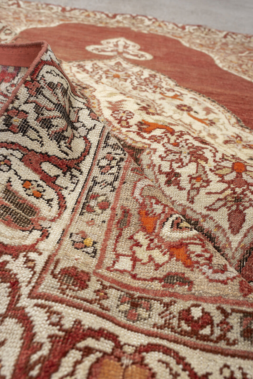 6' x 4' one-of-a-kind handmade antique Anatolian rug. Color palette: terracotta, ivory, rust, taupe, coral, camel, brown