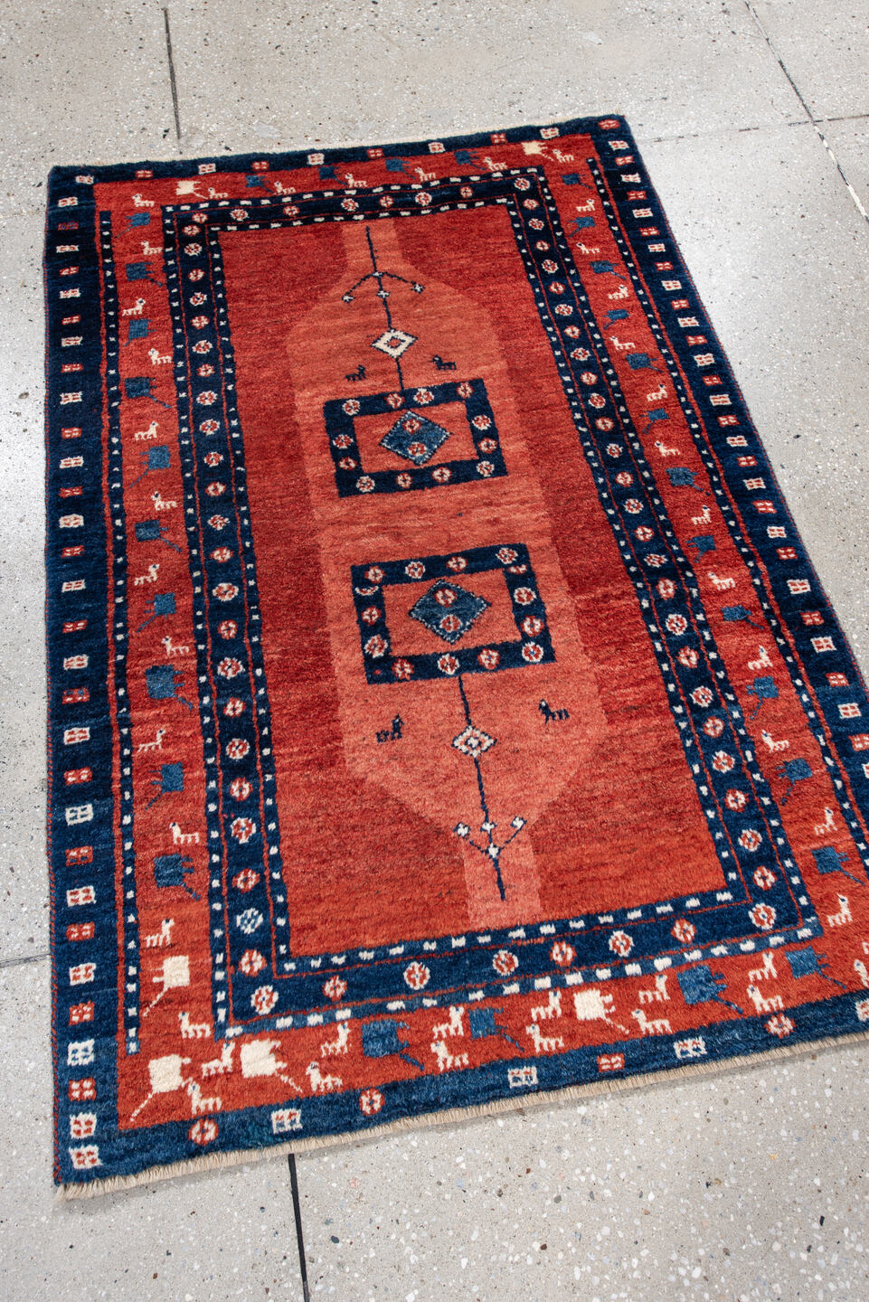 2' x 4' one-of-a-kind handmade vintage Gabbe small size rug. Color palette: black, blue, brown, gray, light gray, off-white