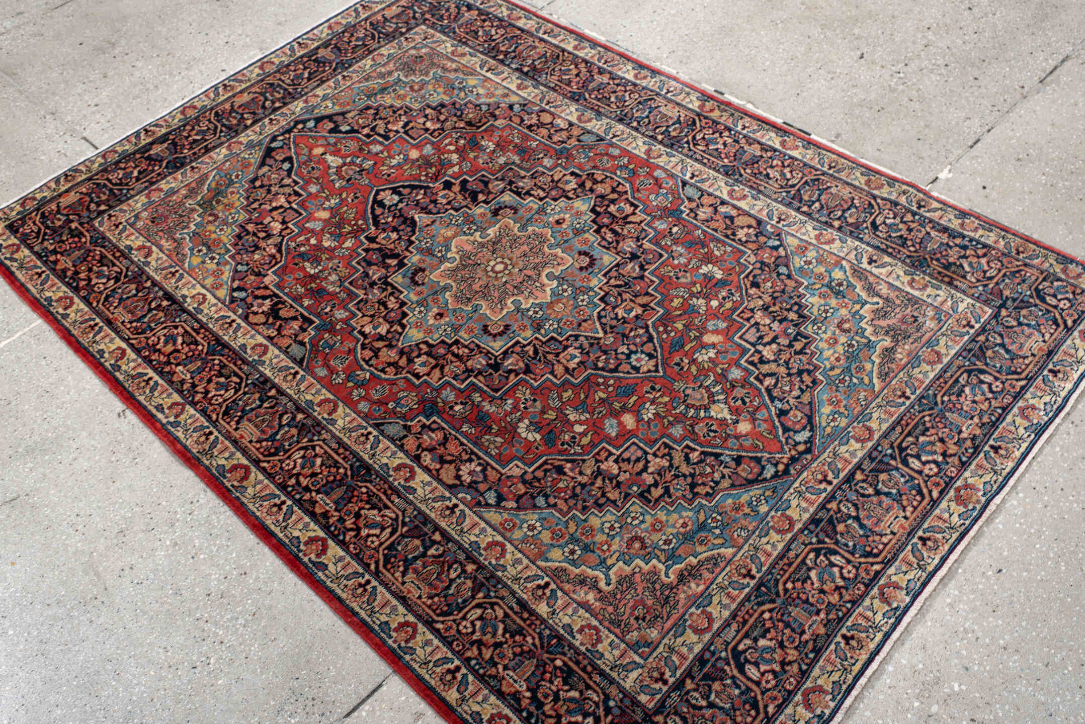 4' x 5' one-of-a-kind handmade antique Kashan small size rug. Color palette: navy, rust, ivory, sky_blue, rose, camel
