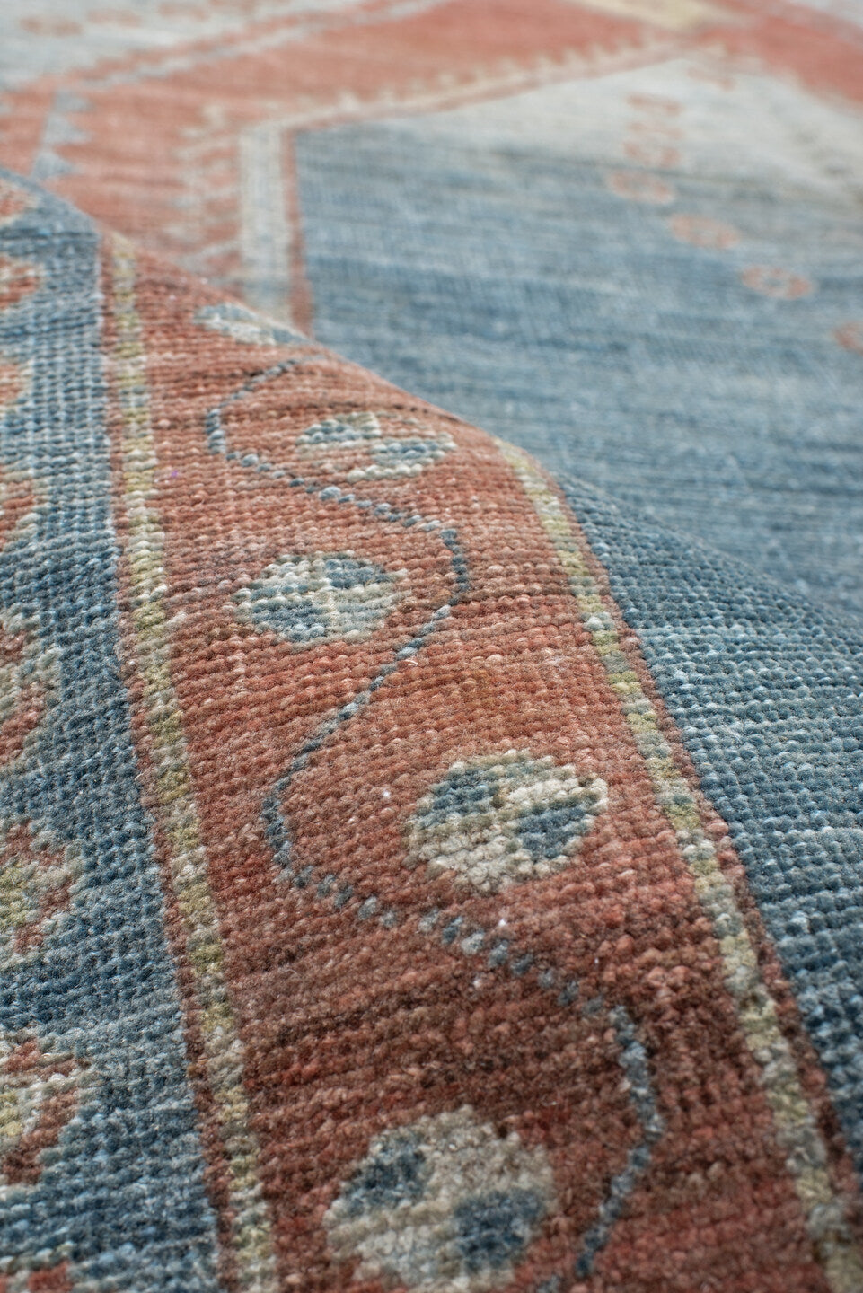 5' x 6' one-of-a-kind handmade antique Gabbe rug. Color palette: blue, terra cotta, ivory, sage, slate, terracotta, brown