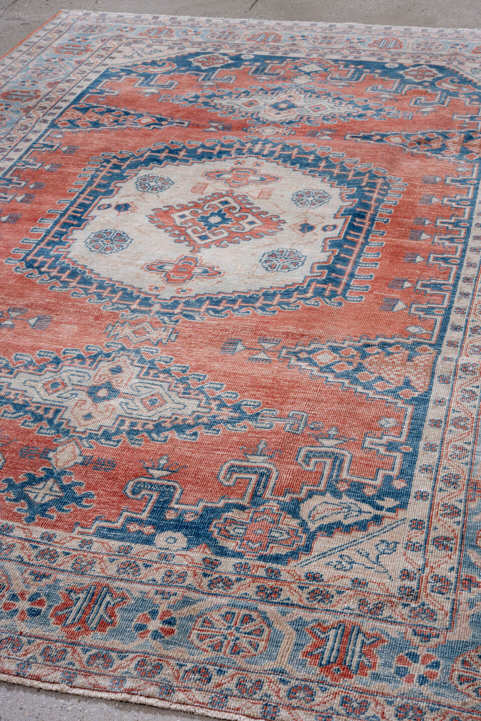 6' x 10' one-of-a-kind handmade vintage Veece large size rug. Color palette: terra cotta, sky blue, ivory, navy, coral