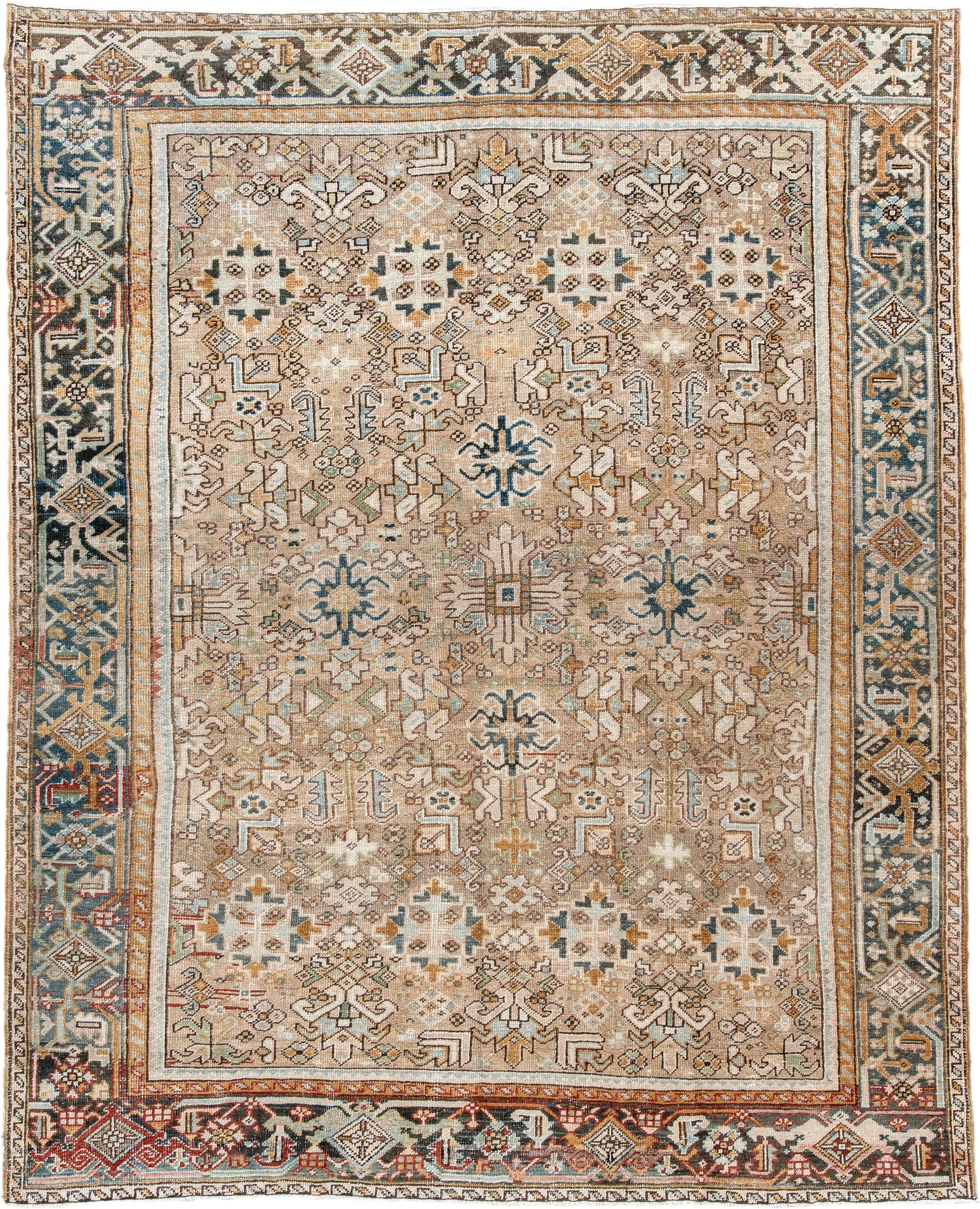 7' x 9' one-of-a-kind handmade antique Heriz rug. Color palette: taupe, ivory, faded indigo, camel, rust, charcoal, beige