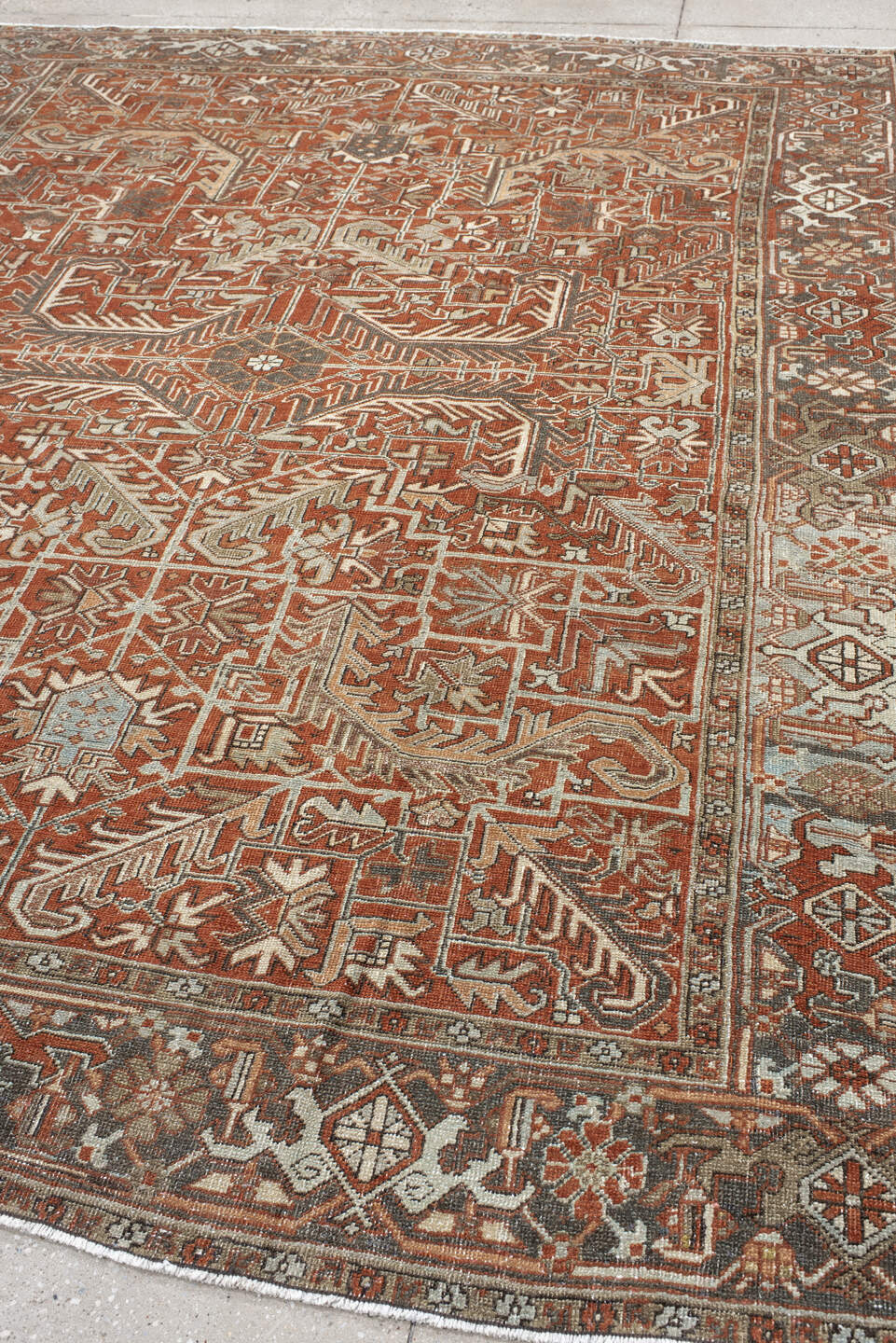 8' x 9' one-of-a-kind handmade antique Heriz rug. Color palette: terra cotta, ivory, taupe, brown, charcoal, rust