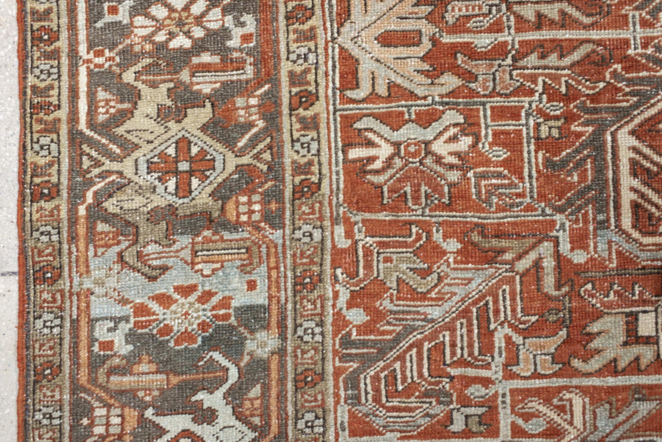 8' x 9' one-of-a-kind handmade antique Heriz rug. Color palette: terra cotta, ivory, taupe, brown, charcoal, rust