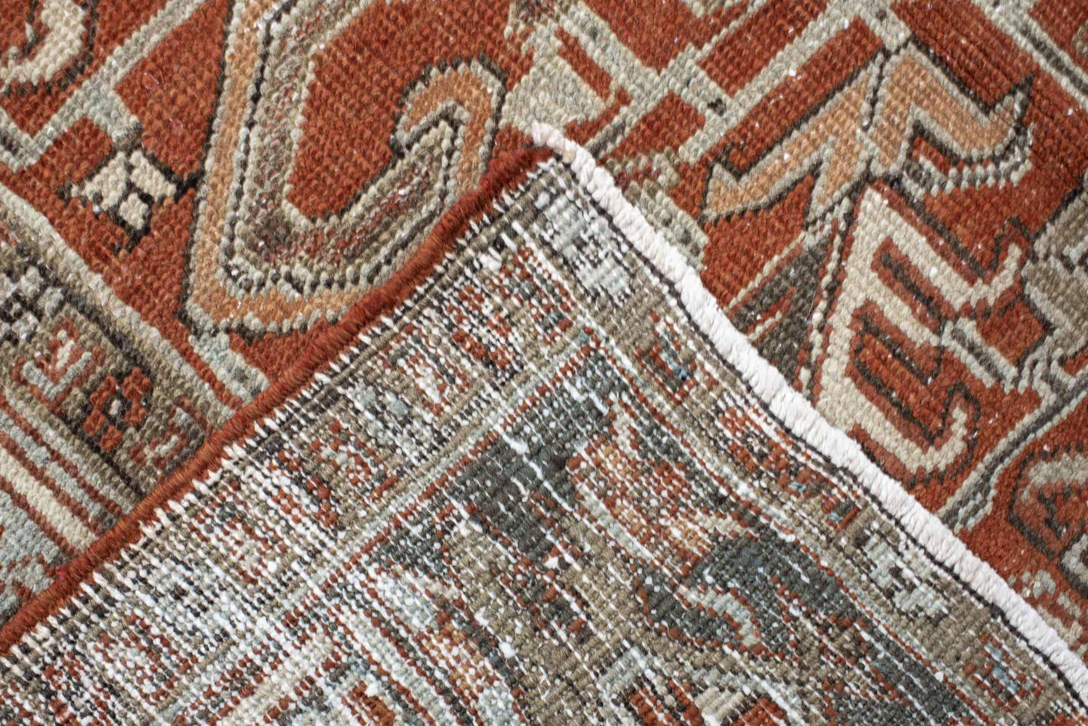 8' x 9' one-of-a-kind handmade antique Heriz rug. Color palette: terra cotta, ivory, taupe, brown, charcoal, rust