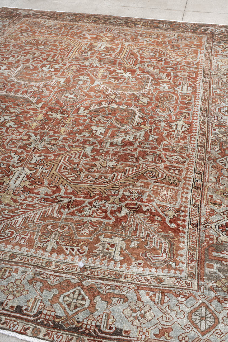 8' x 10' one-of-a-kind handmade antique large size rug. Color palette: terra cotta, ivory, pale blue, rust, taupe, brown
