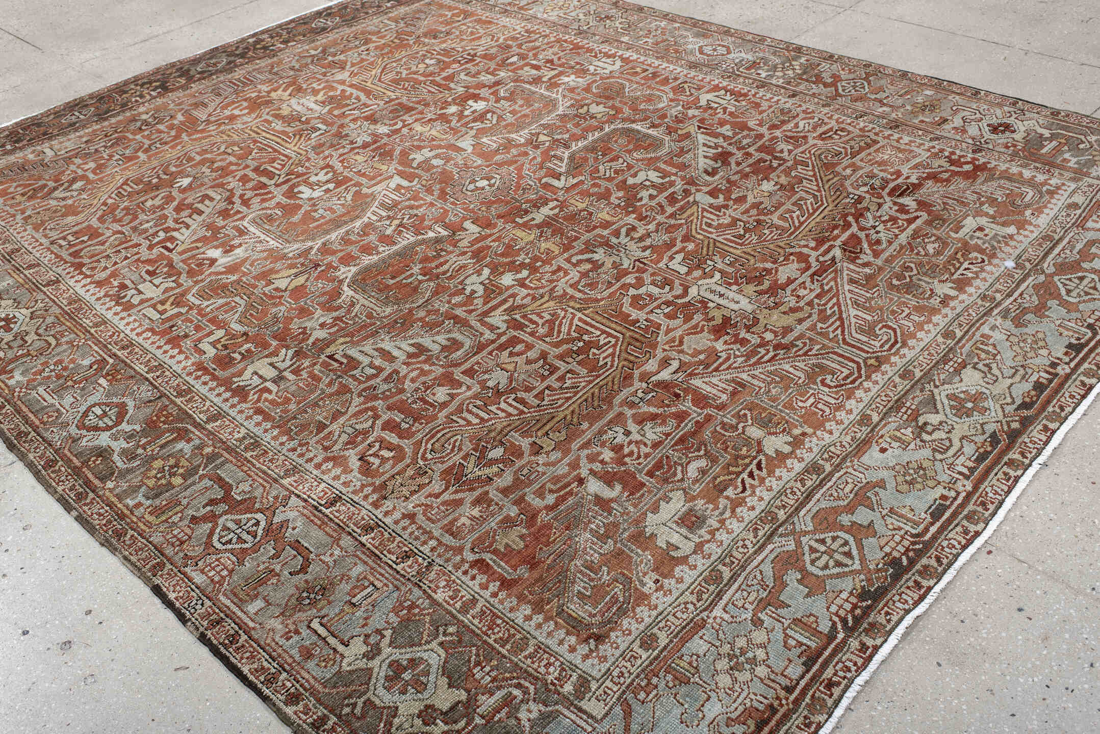 8' x 10' one-of-a-kind handmade antique large size rug. Color palette: terra cotta, ivory, pale blue, rust, taupe, brown