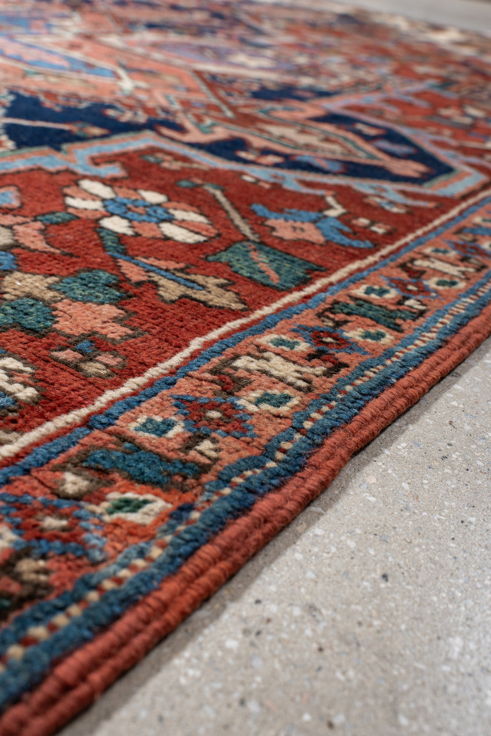6' x 9' one-of-a-kind handmade vintage Heriz medium size rug. Color palette: rust, ivory, navy, sky blue, coral, teal, sage