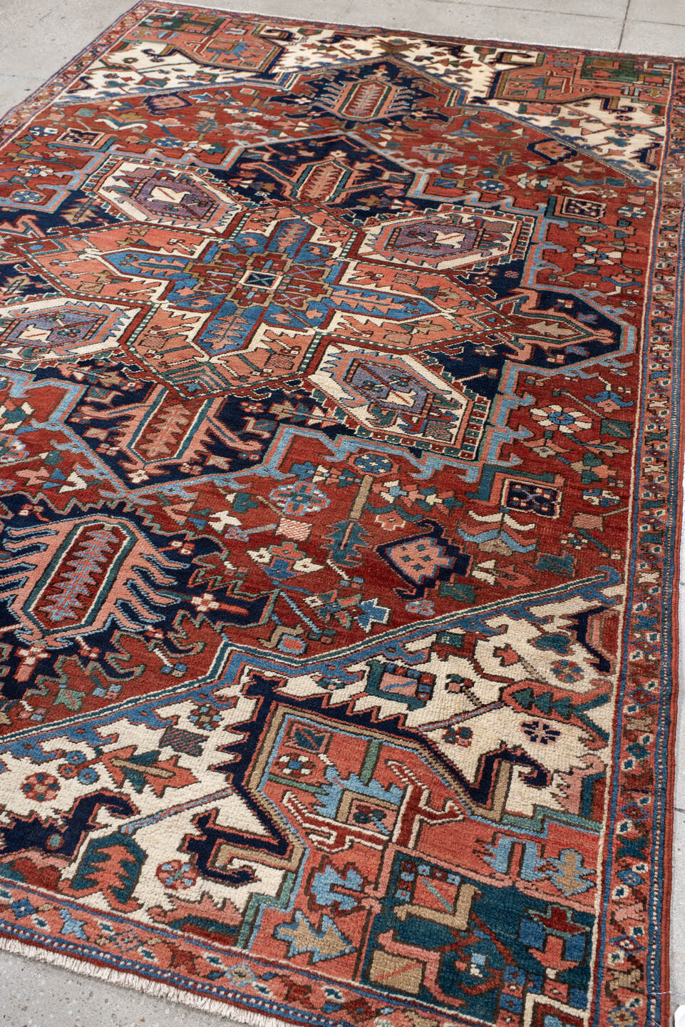 6' x 9' one-of-a-kind handmade vintage Heriz medium size rug. Color palette: rust, ivory, navy, sky blue, coral, teal, sage