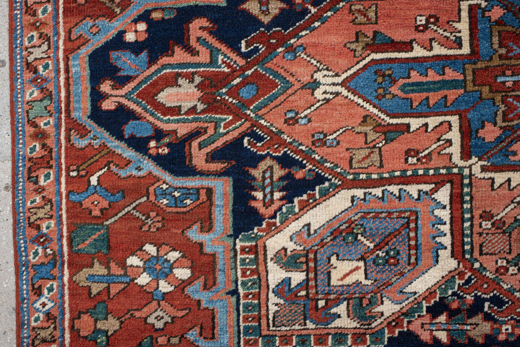 6' x 9' one-of-a-kind handmade vintage Heriz medium size rug. Color palette: rust, ivory, navy, sky blue, coral, teal, sage