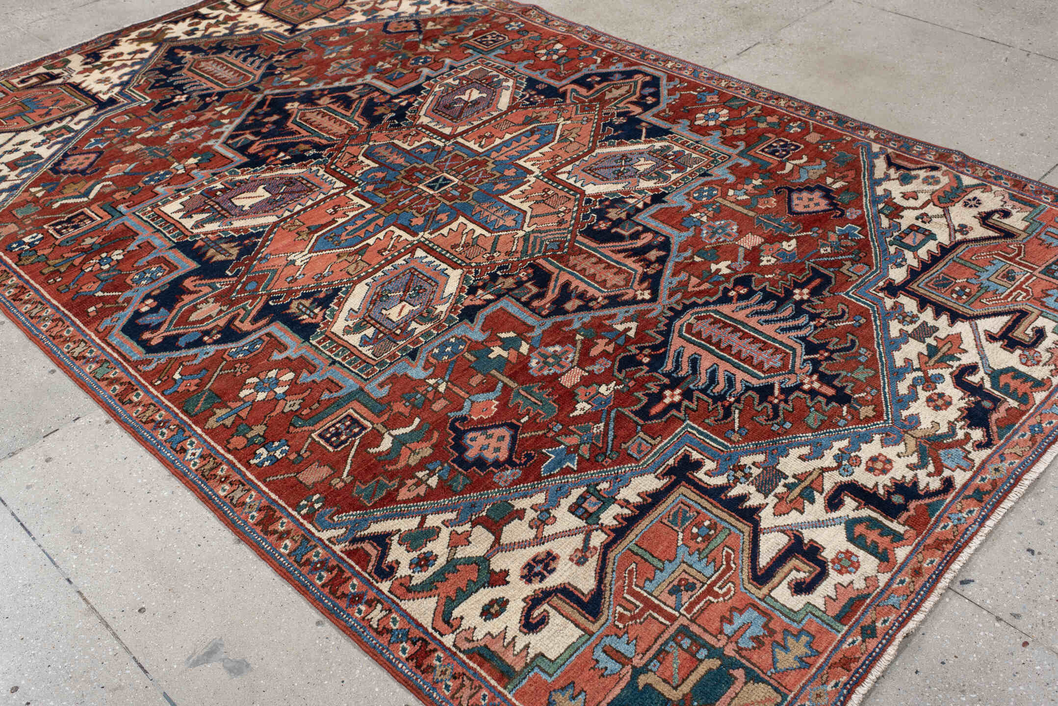 6' x 9' one-of-a-kind handmade vintage Heriz medium size rug. Color palette: rust, ivory, navy, sky blue, coral, teal, sage
