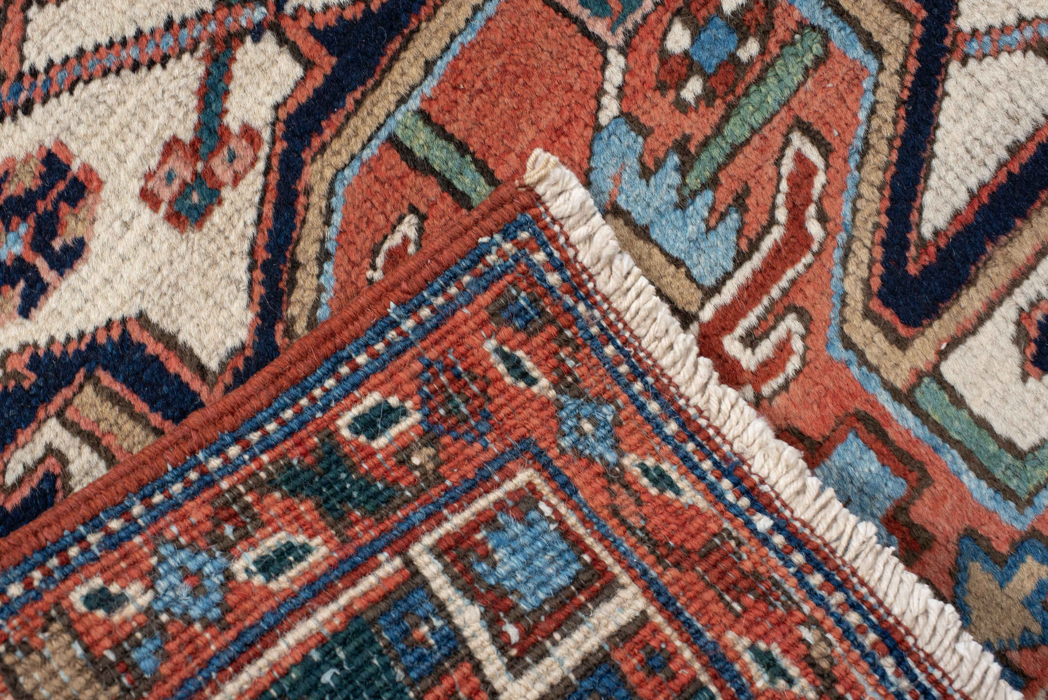 6' x 9' one-of-a-kind handmade vintage Heriz medium size rug. Color palette: rust, ivory, navy, sky blue, coral, teal, sage