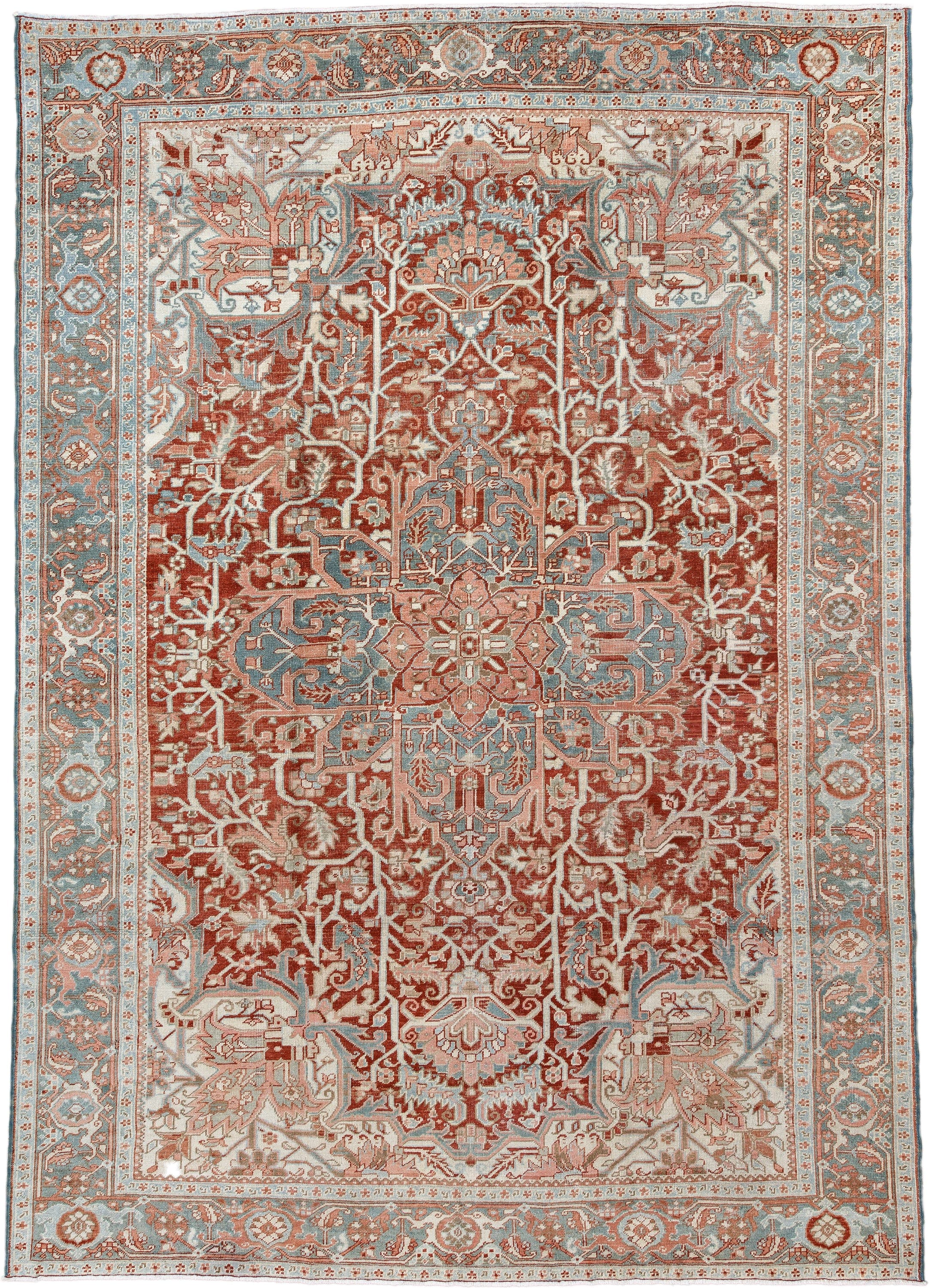 7' x 10' one-of-a-kind handmade antique Heriz large size rug. Color palette: rust, ivory, pale blue, terra cotta, sage