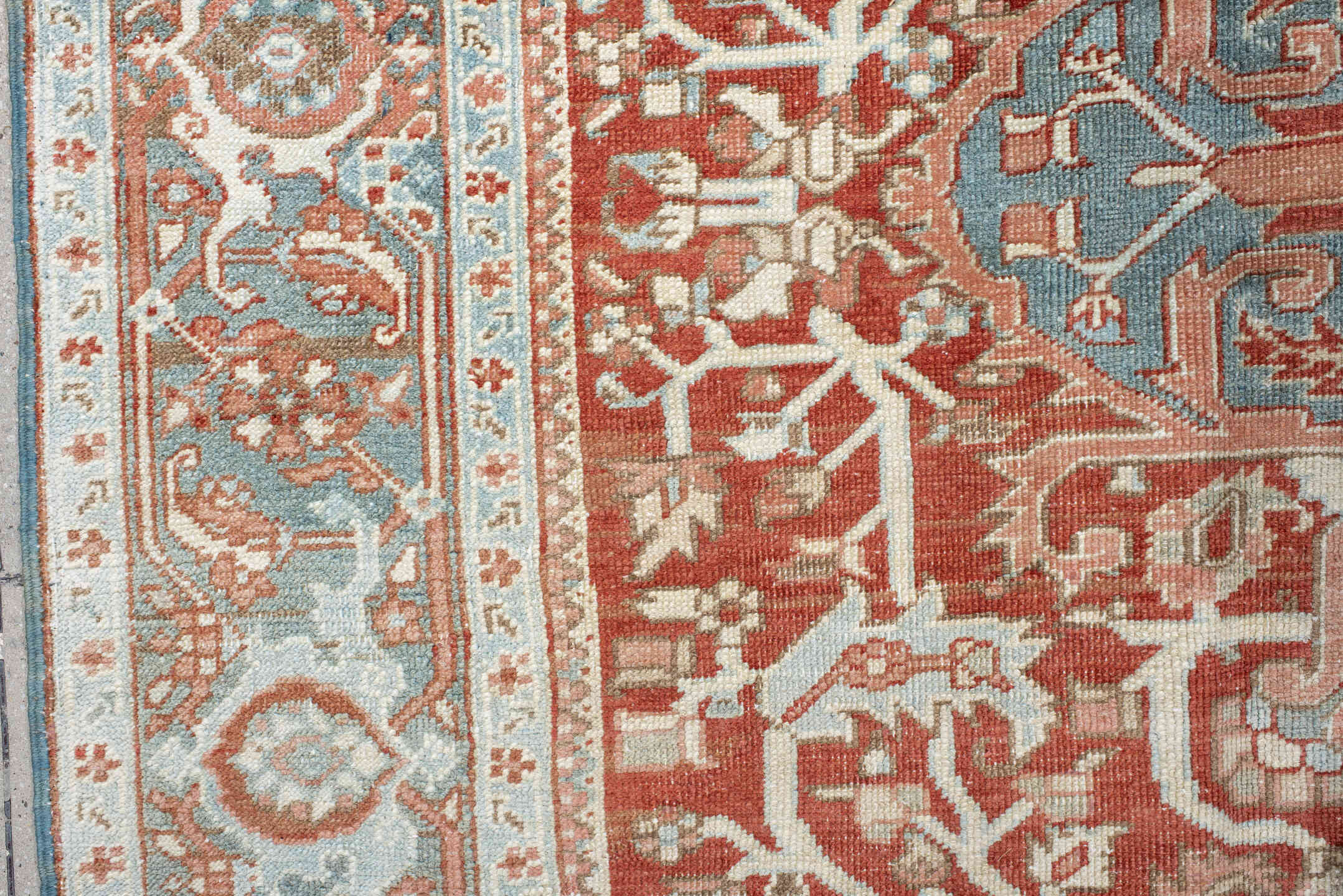 7' x 10' one-of-a-kind handmade antique Heriz large size rug. Color palette: rust, ivory, pale blue, terra cotta, sage