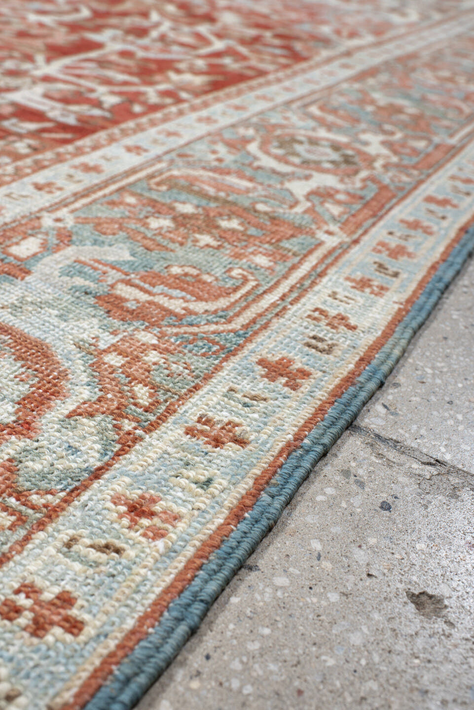 7' x 10' one-of-a-kind handmade antique Heriz large size rug. Color palette: rust, ivory, pale blue, terra cotta, sage