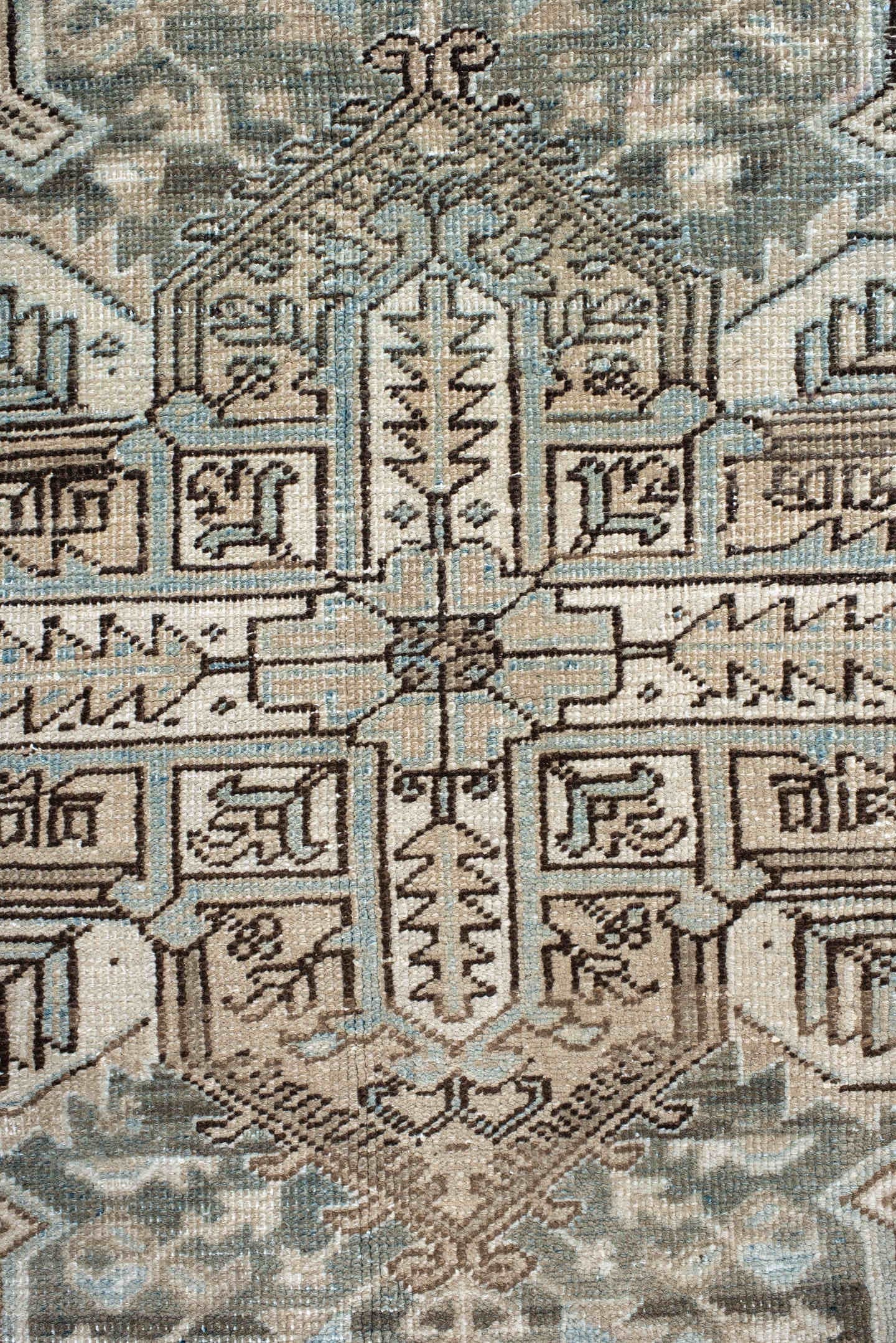 7' x 8' one-of-a-kind handmade antique Heriz rug. Color palette: ivory, pale blue, taupe, brown, beige, camel, slate