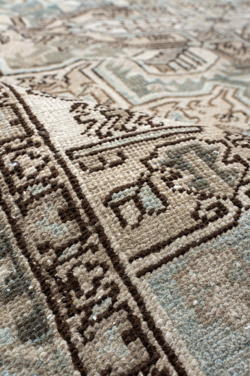 7' x 8' one-of-a-kind handmade antique Heriz rug. Color palette: ivory, pale blue, taupe, brown, beige, camel, slate