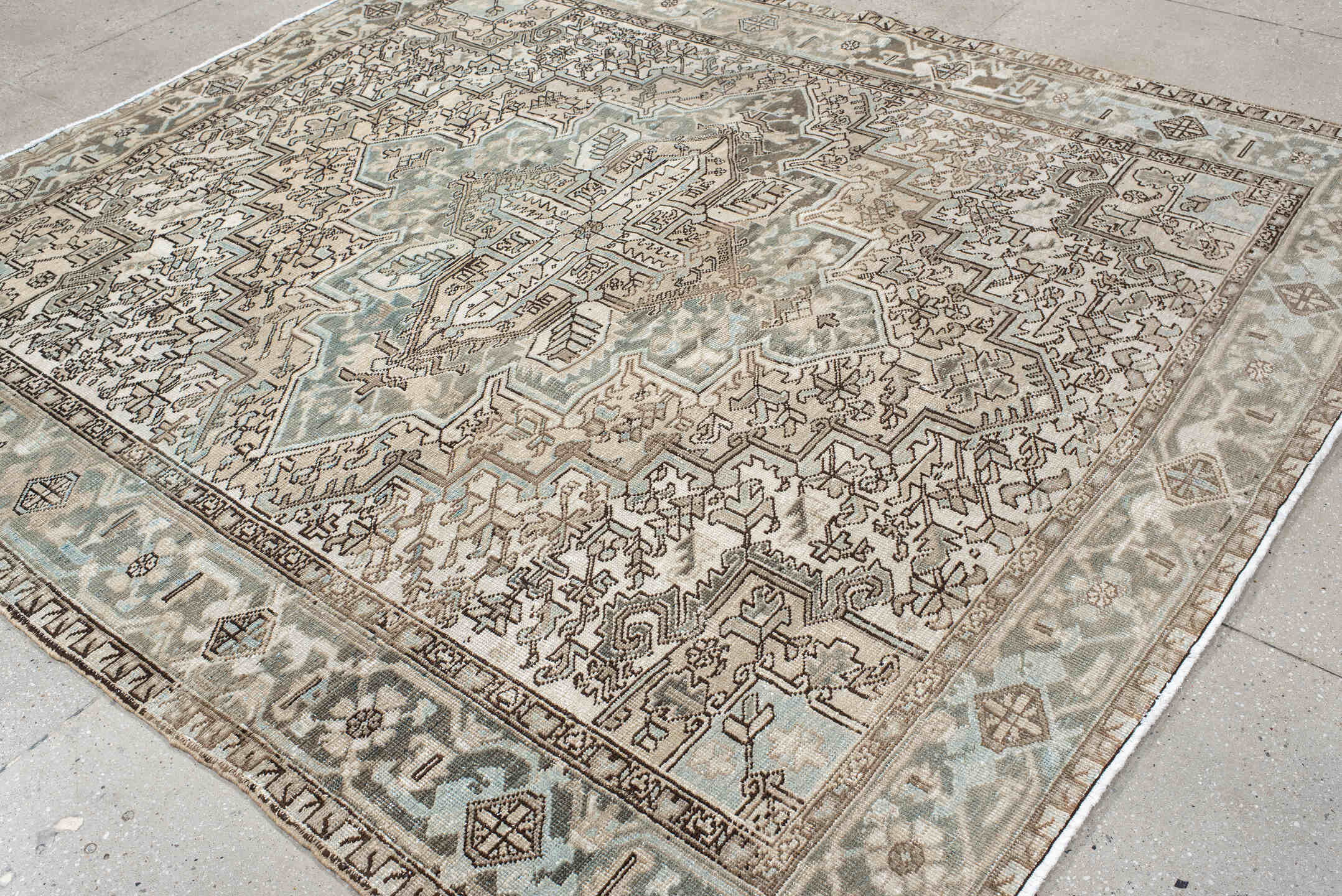 7' x 8' one-of-a-kind handmade antique Heriz rug. Color palette: ivory, pale blue, taupe, brown, beige, camel, slate