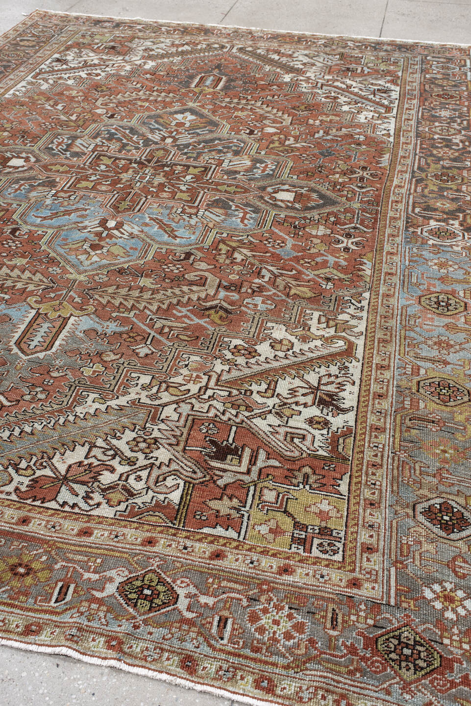 8' x 11' one-of-a-kind handmade vintage Heriz large size rug. Color palette: terra cotta, ivory, sky blue, charcoal, taupe