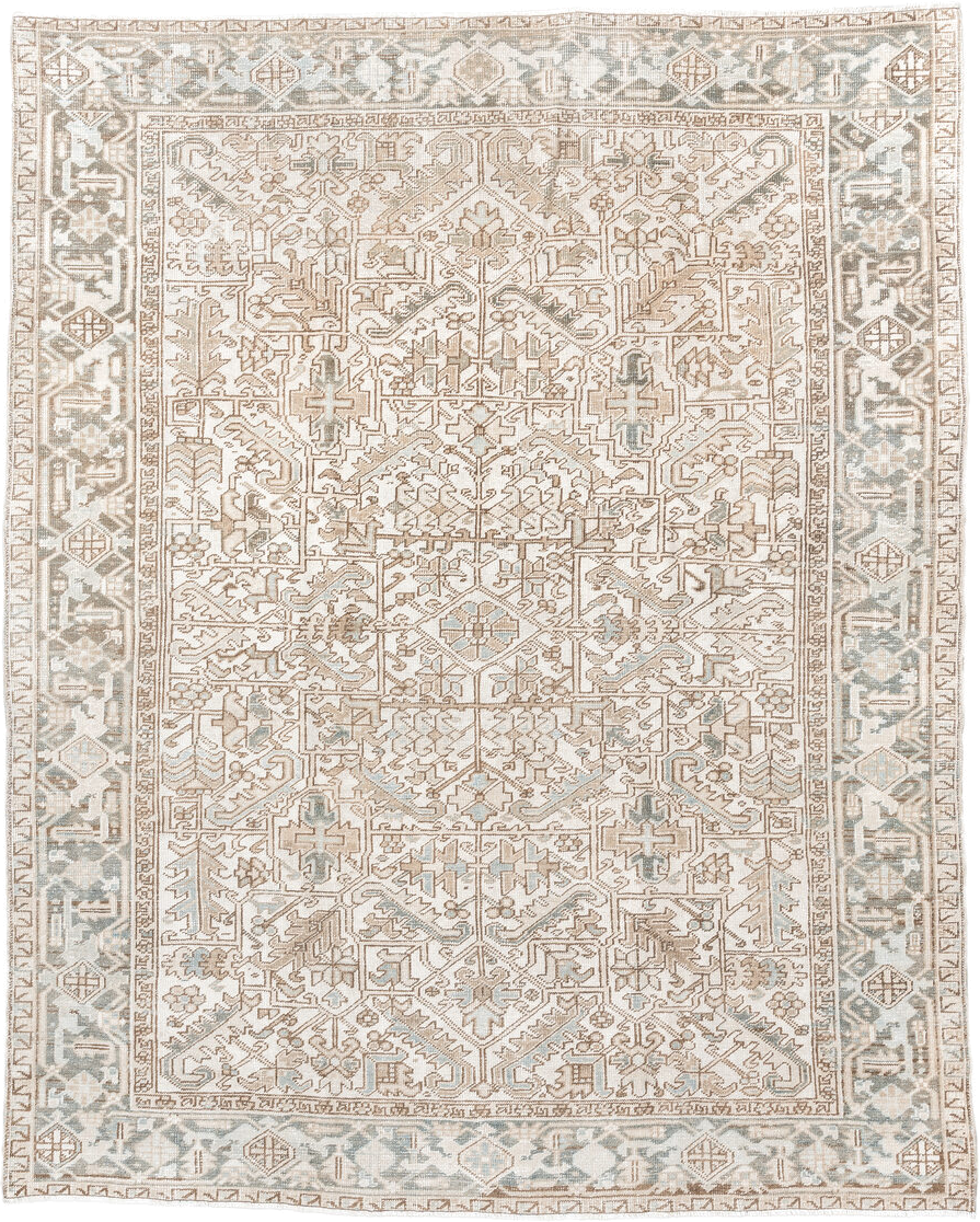 7' x 9' one-of-a-kind handmade antique Heriz rug. Color palette: ivory, camel, pale blue, taupe, beige, light gray