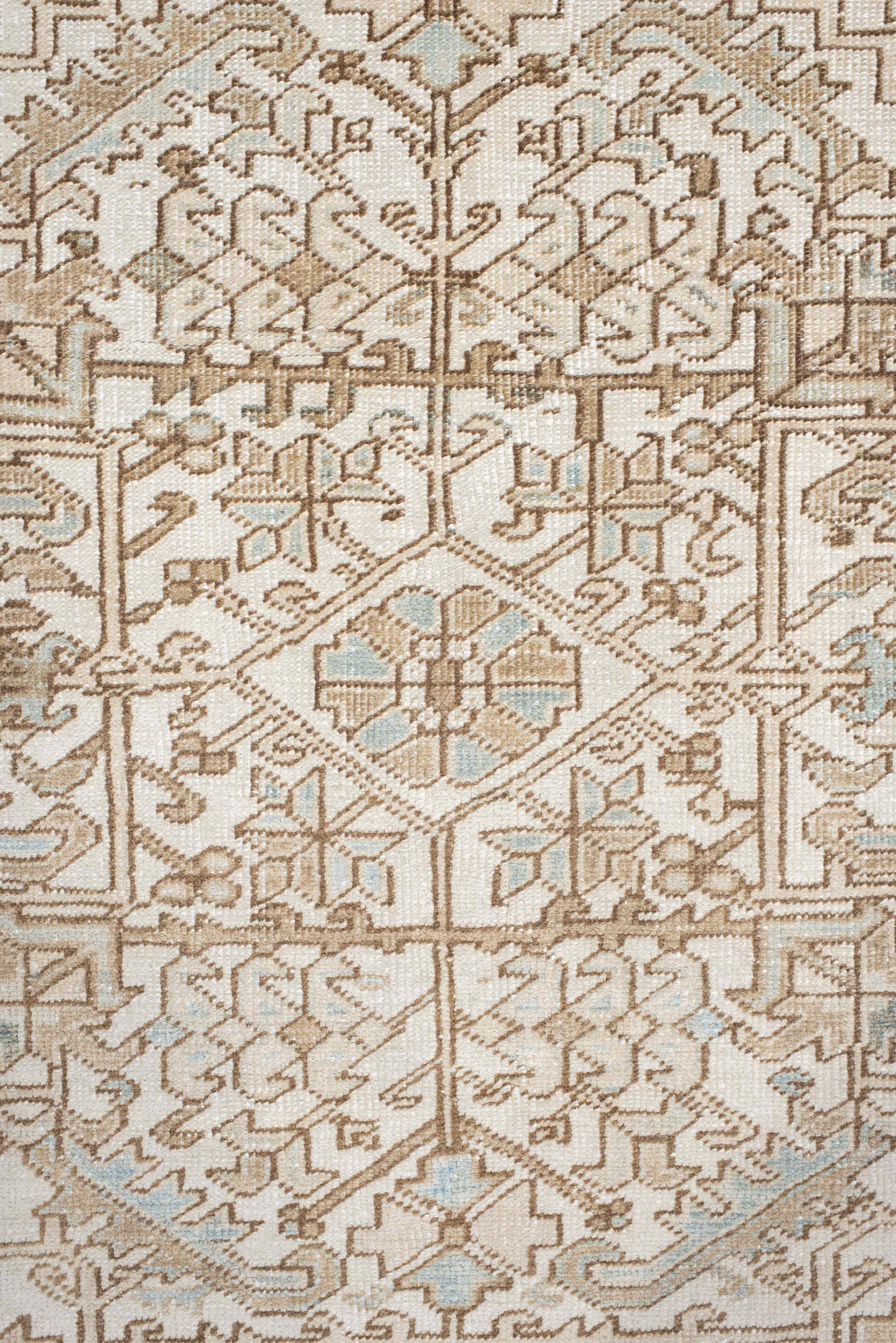 7' x 9' one-of-a-kind handmade antique Heriz rug. Color palette: ivory, camel, pale blue, taupe, beige, light gray