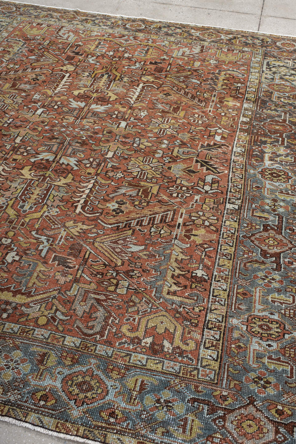 6' x 7' one-of-a-kind handmade vintage Heriz rug. Color palette: terra cotta, slate blue, ivory, charcoal, rust, camel