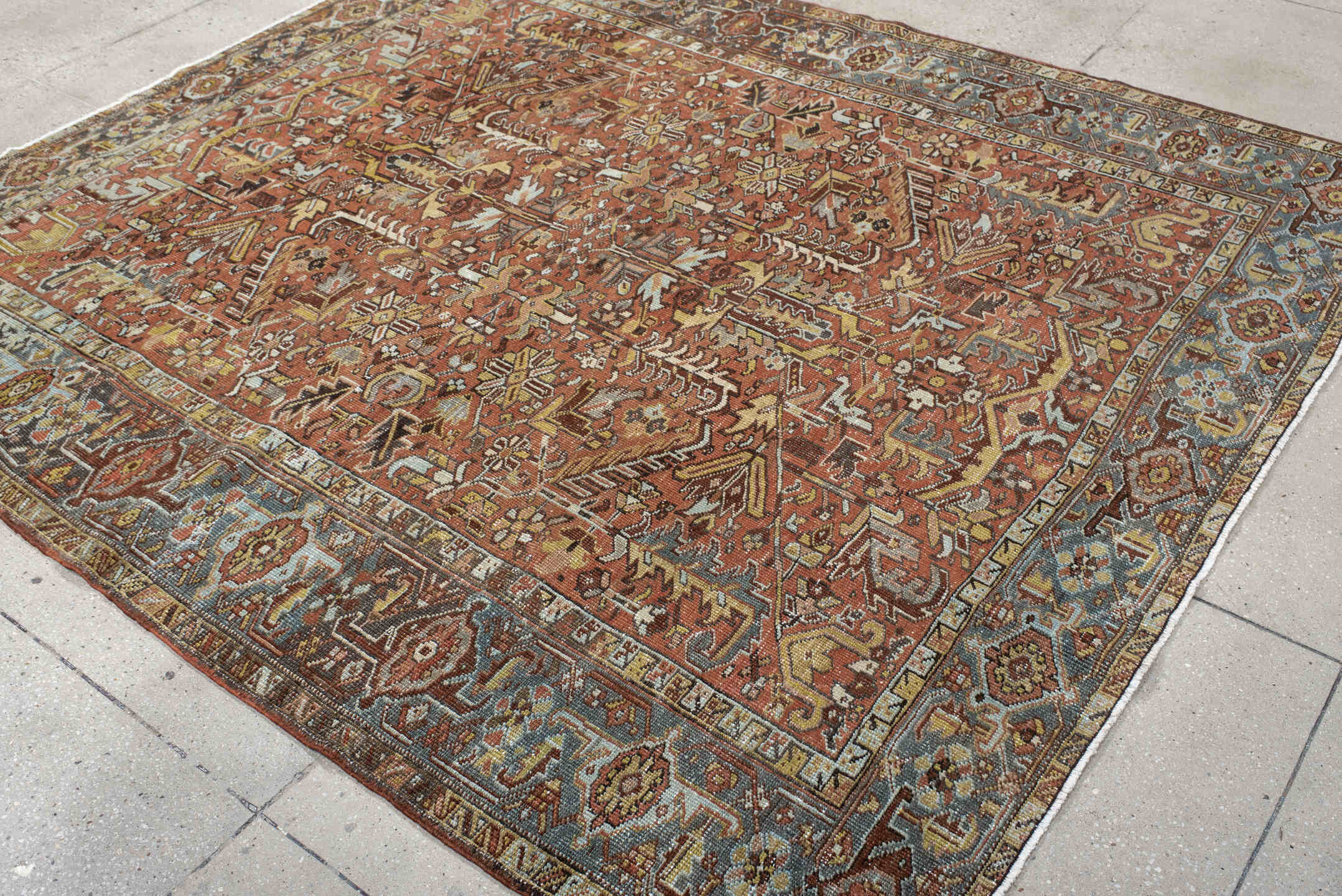 6' x 7' one-of-a-kind handmade vintage Heriz rug. Color palette: terra cotta, slate blue, ivory, charcoal, rust, camel