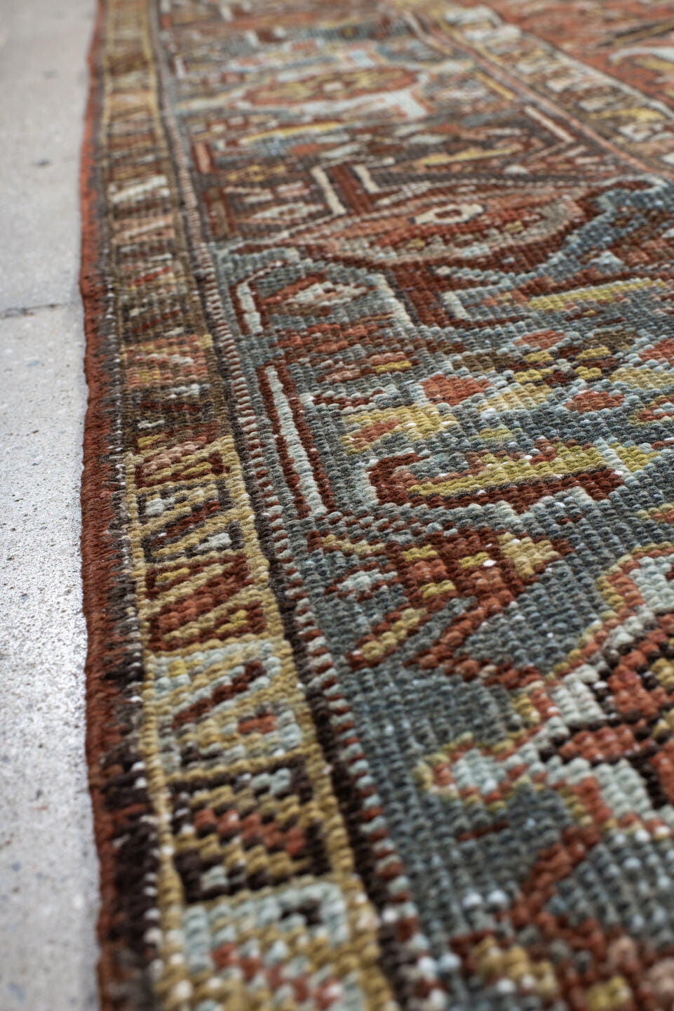 6' x 7' one-of-a-kind handmade vintage Heriz rug. Color palette: terra cotta, slate blue, ivory, charcoal, rust, camel