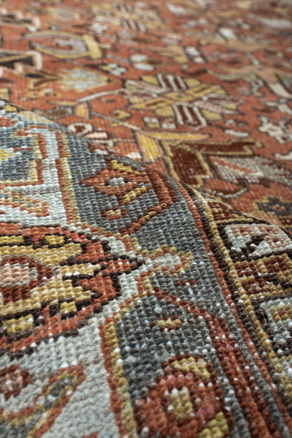 6' x 7' one-of-a-kind handmade vintage Heriz rug. Color palette: terra cotta, slate blue, ivory, charcoal, rust, camel