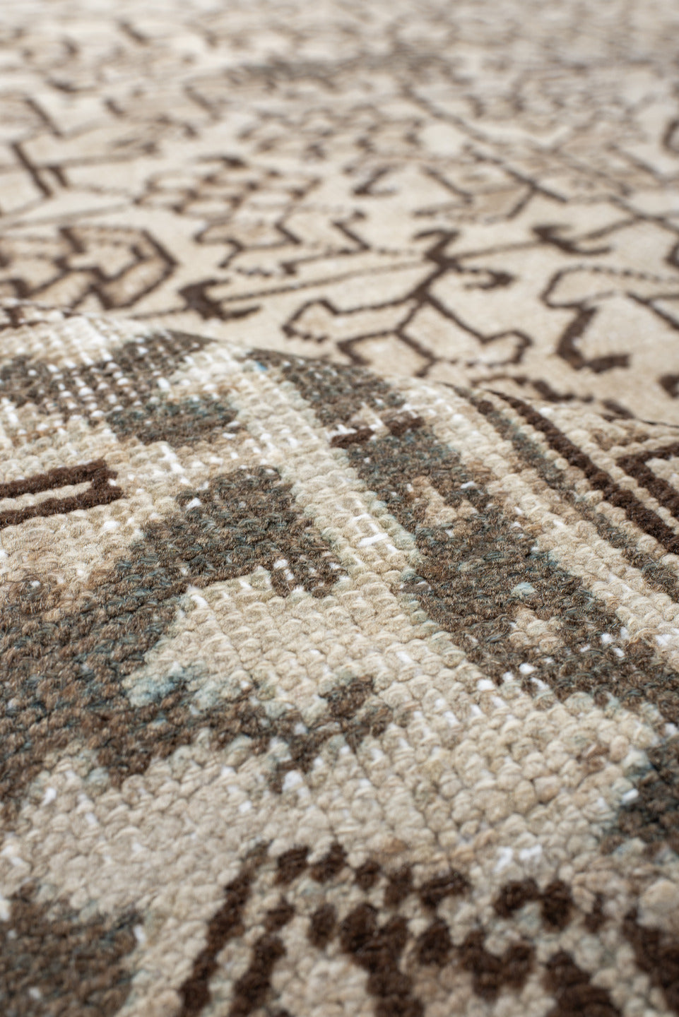 7' x 8' one-of-a-kind handmade antique Heriz rug. Color palette: ivory, taupe, brown, charcoal, beige, gray, black