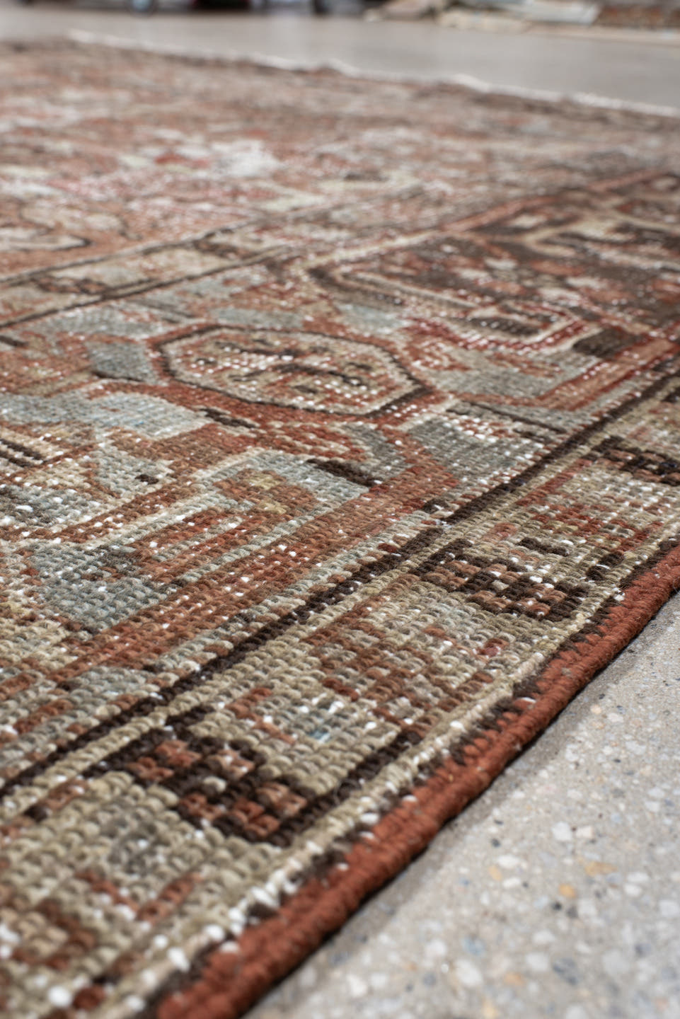 6' x 9' one-of-a-kind handmade antique Heriz medium size rug. Color palette: terra cotta, ivory, taupe, charcoal, slate