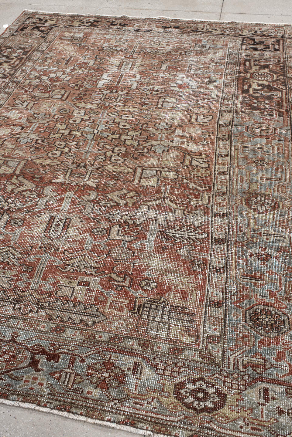 6' x 9' one-of-a-kind handmade antique Heriz medium size rug. Color palette: terra cotta, ivory, taupe, charcoal, slate