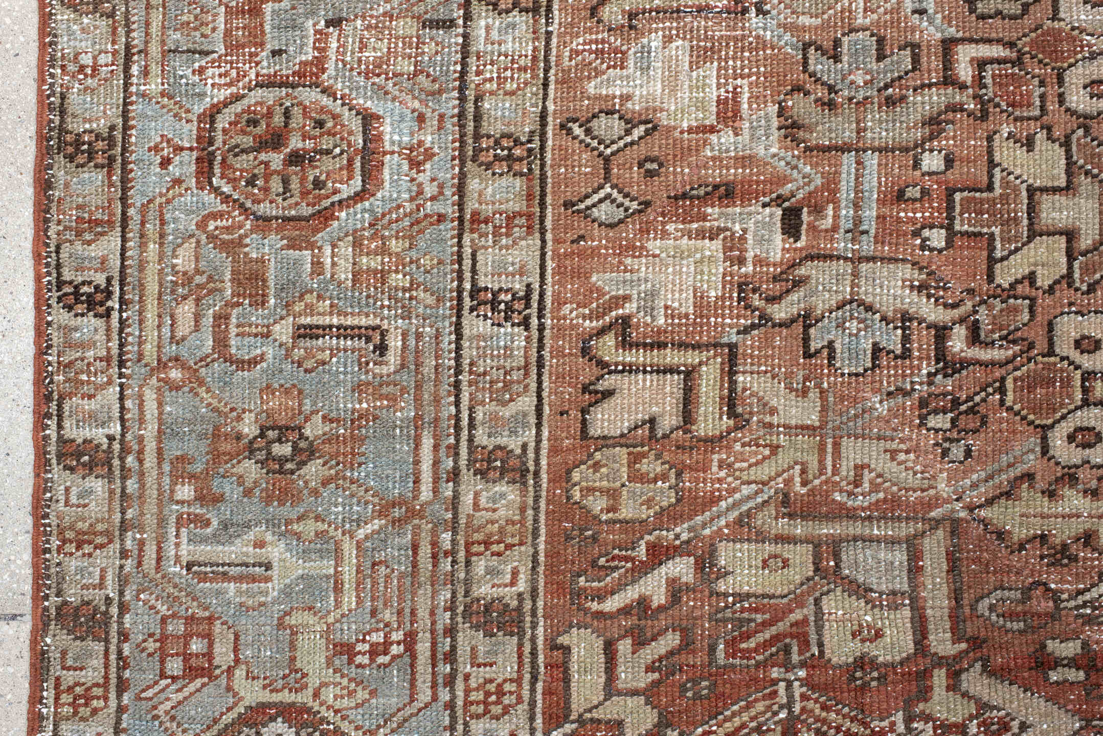 6' x 9' one-of-a-kind handmade antique Heriz medium size rug. Color palette: terra cotta, ivory, taupe, charcoal, slate