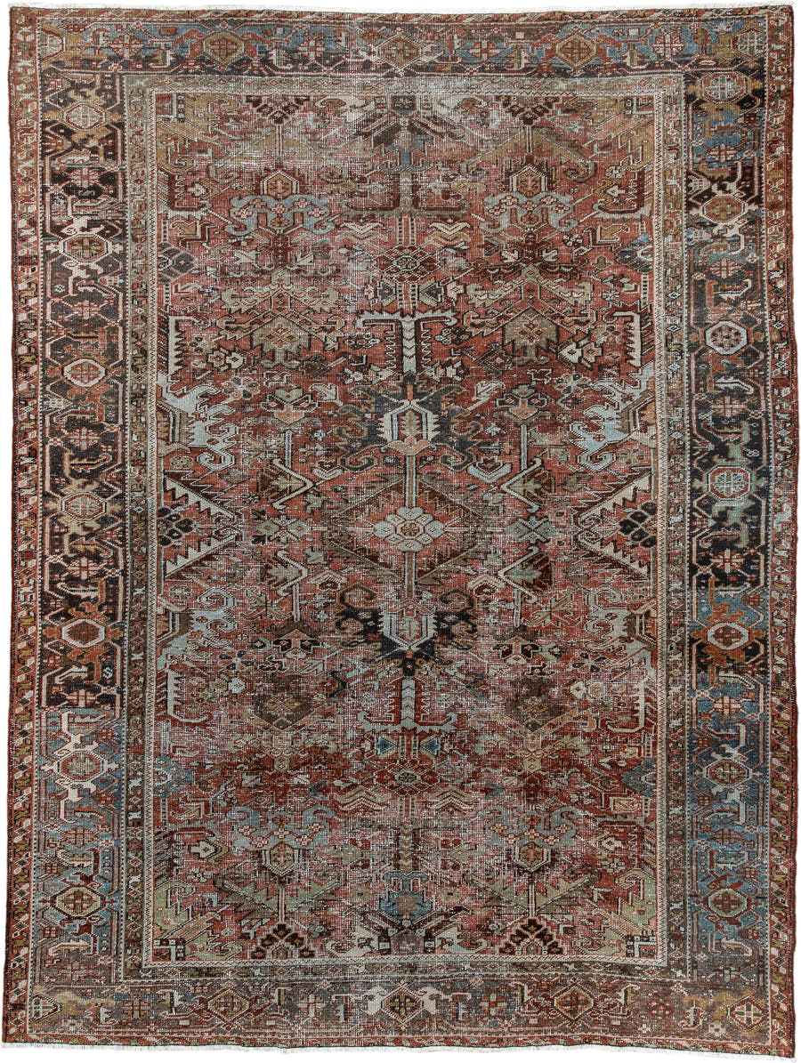 7' x 9' one-of-a-kind handmade antique Heriz rug. Color palette: rust, ivory, sky blue, charcoal, taupe, camel, brown