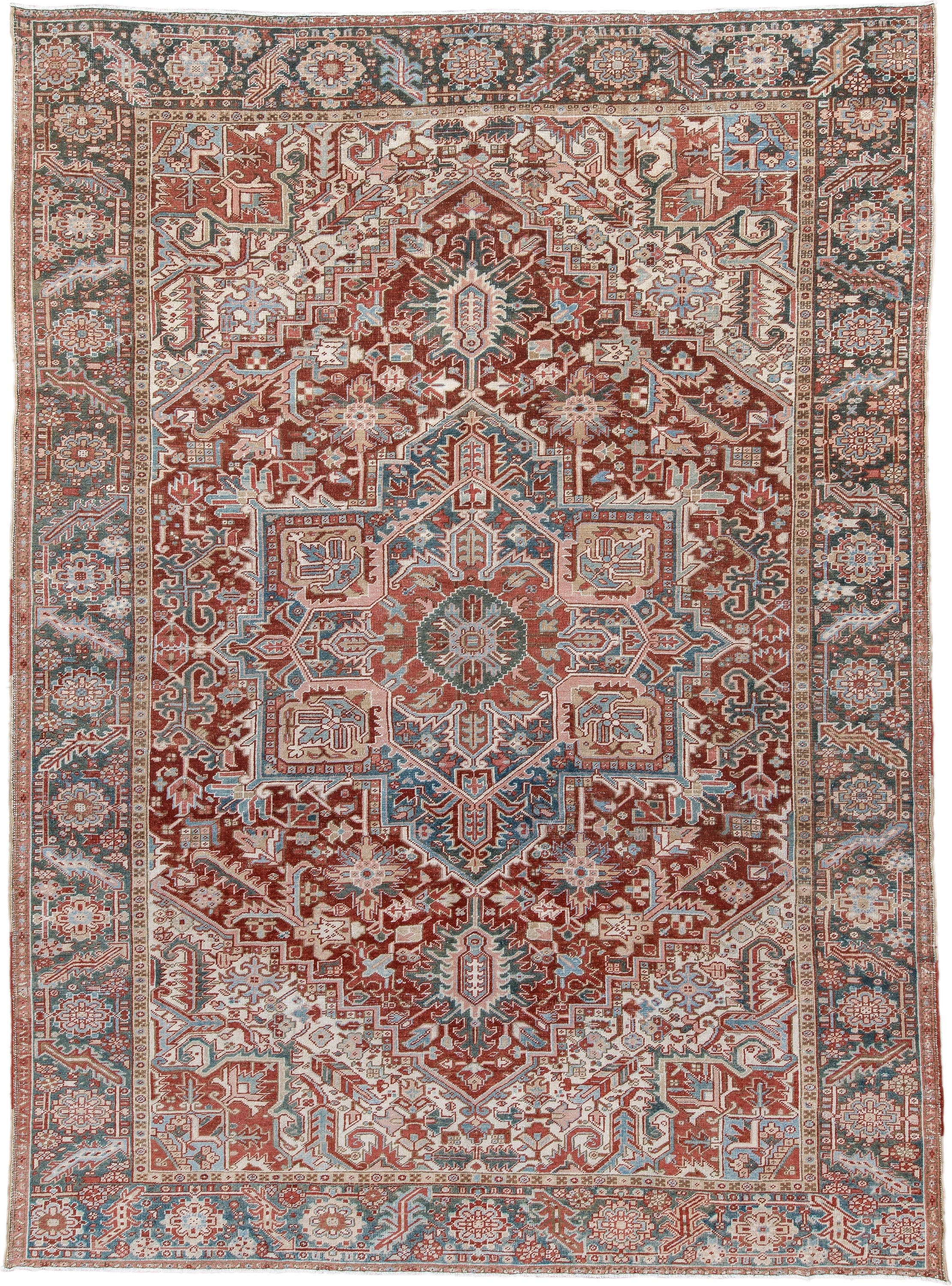8' x 12' one-of-a-kind handmade antique Heriz large size rug. Color palette: rust, ivory, sky blue, slate, brick, cream