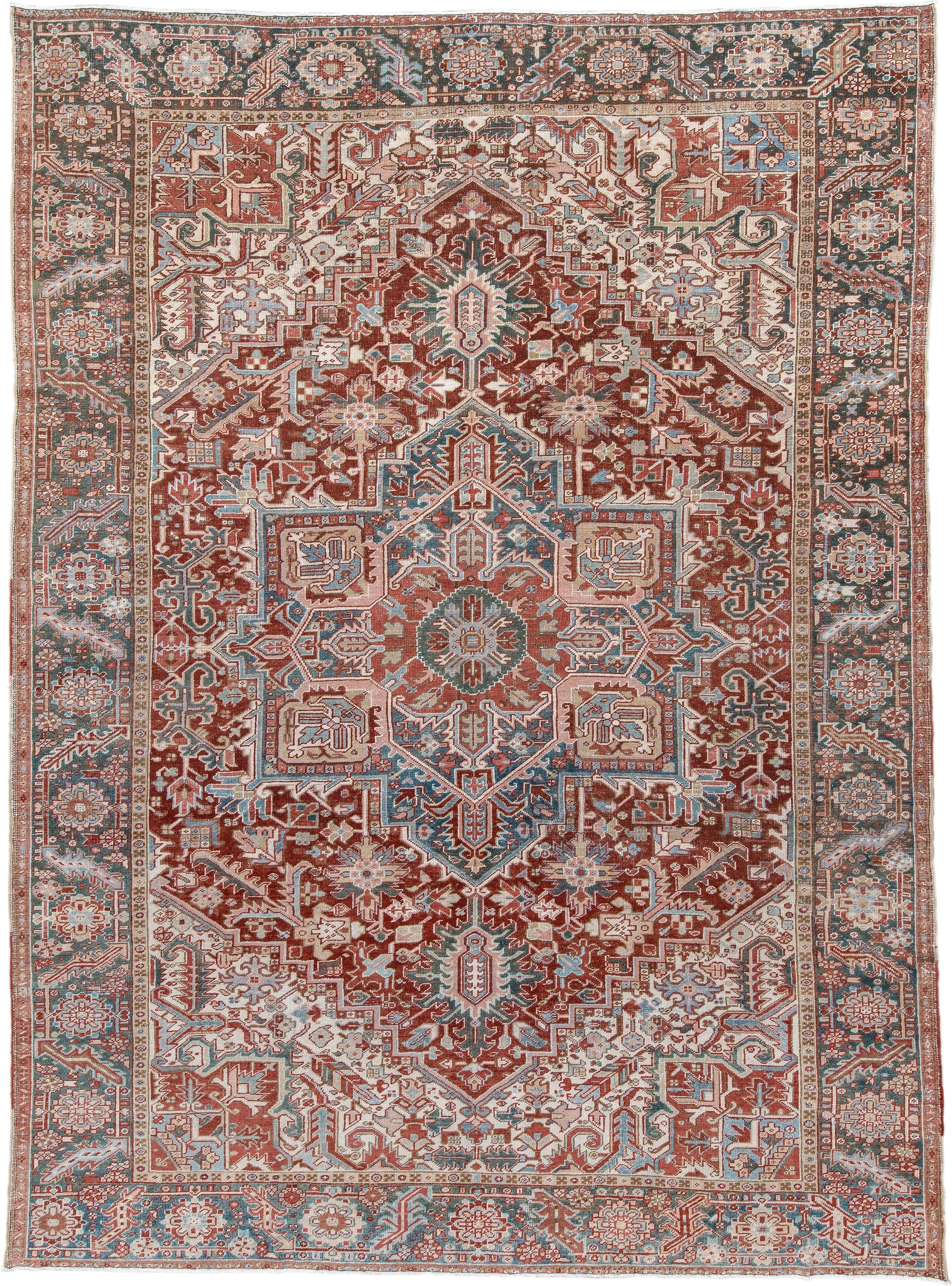 8' x 12' one-of-a-kind handmade antique Heriz large size rug. Color palette: rust, ivory, sky blue, slate, brick, cream