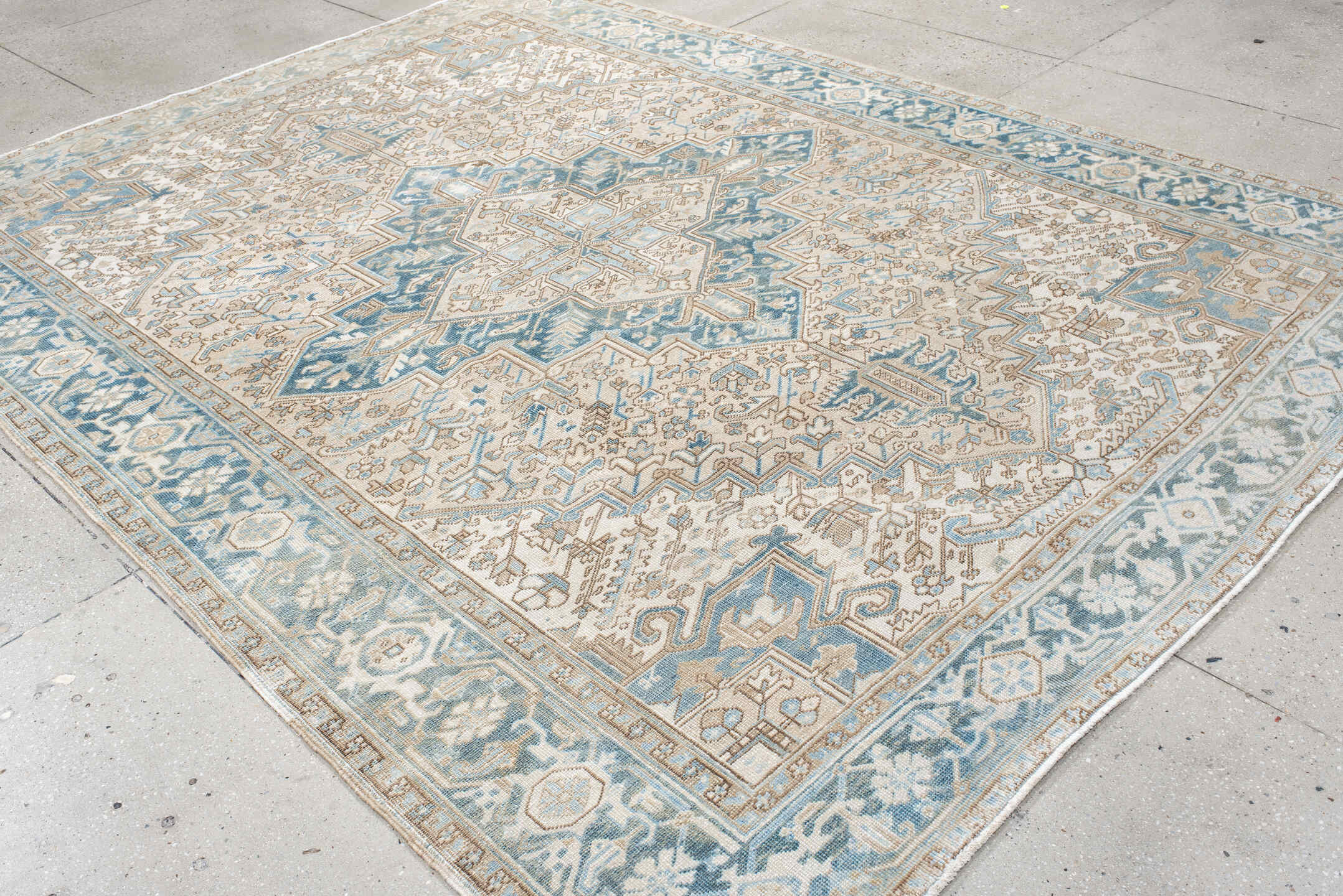 8' x 10' one-of-a-kind handmade antique Heriz large size rug. Color palette: ivory, sky blue, camel, taupe, light blue