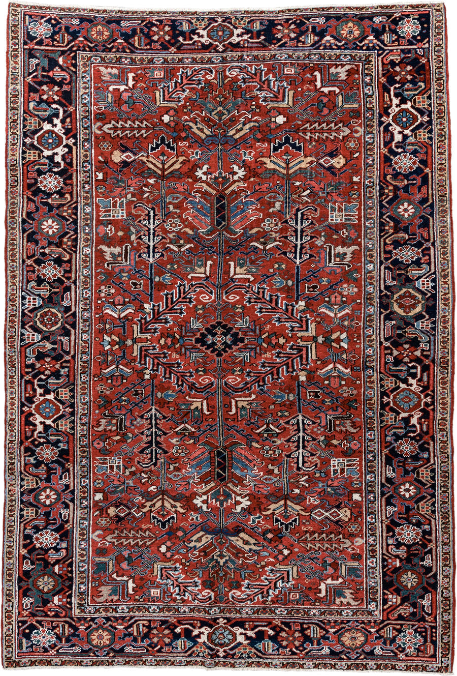 6' x 9' one-of-a-kind handmade antique Heriz medium size rug. Color palette: rust, navy, ivory, sky blue, coral, slate