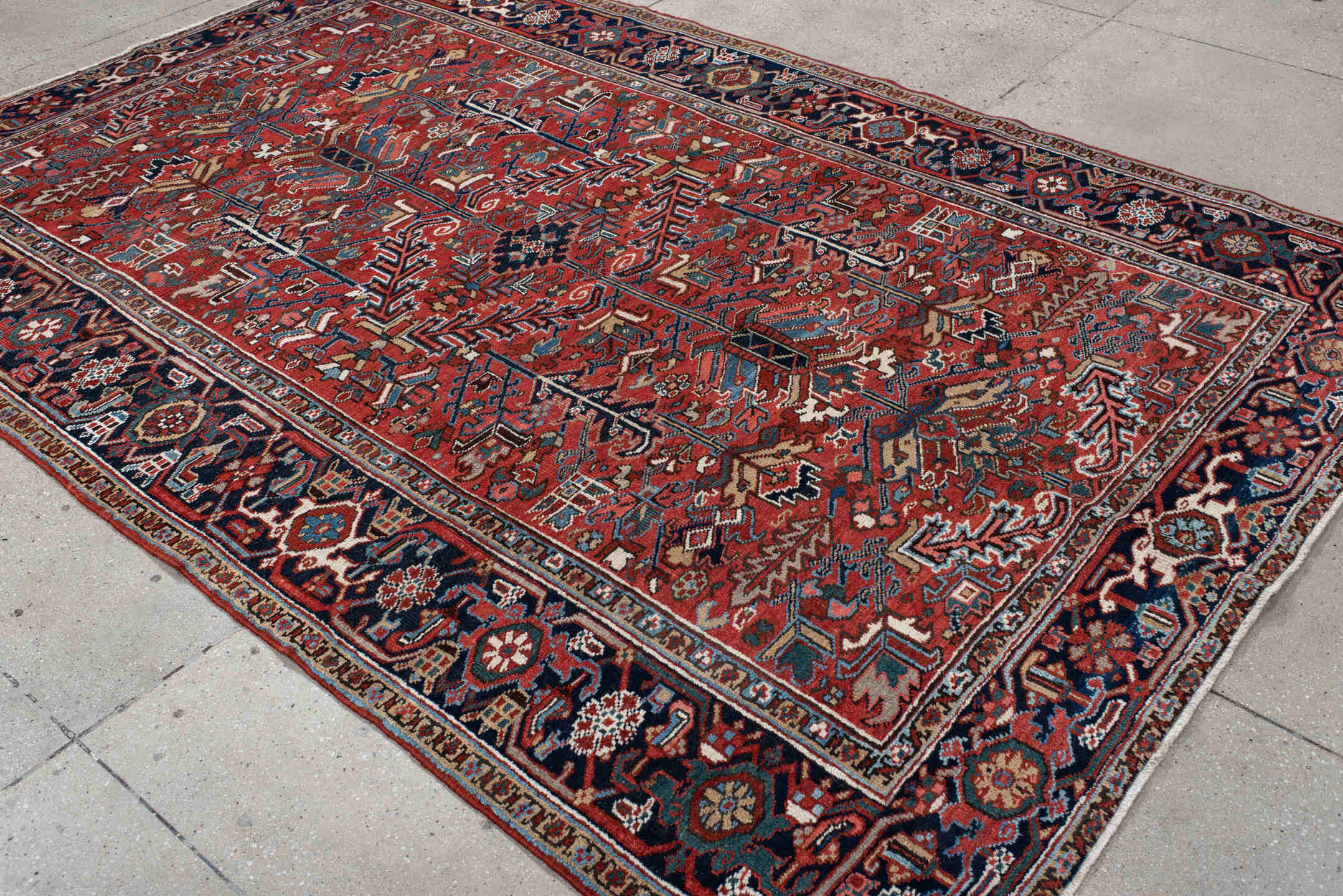 6' x 9' one-of-a-kind handmade antique Heriz medium size rug. Color palette: rust, navy, ivory, sky blue, coral, slate