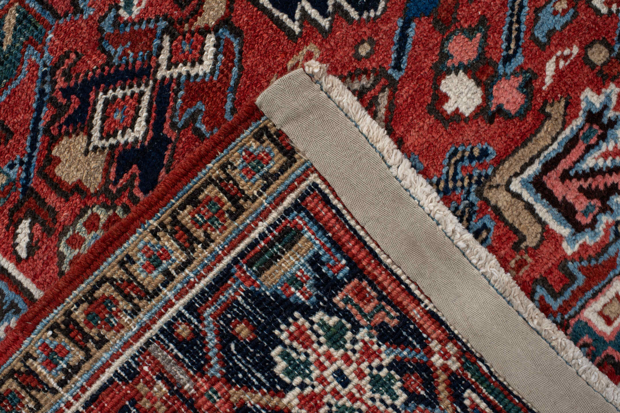 6' x 9' one-of-a-kind handmade antique Heriz medium size rug. Color palette: rust, navy, ivory, sky blue, coral, slate