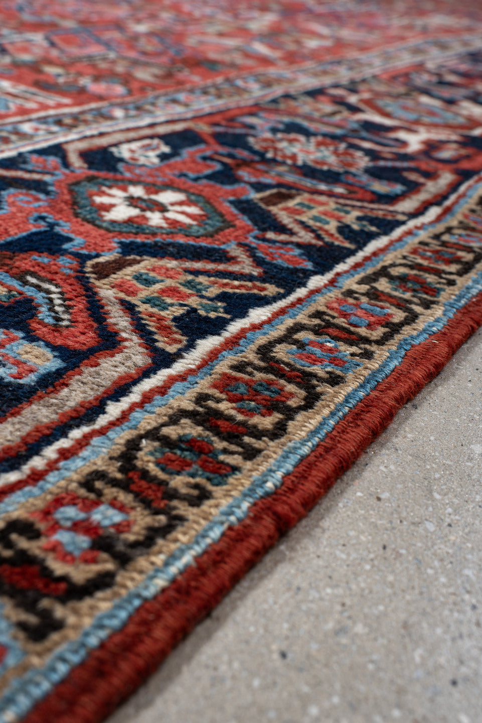6' x 9' one-of-a-kind handmade antique Heriz medium size rug. Color palette: rust, navy, ivory, sky blue, coral, slate