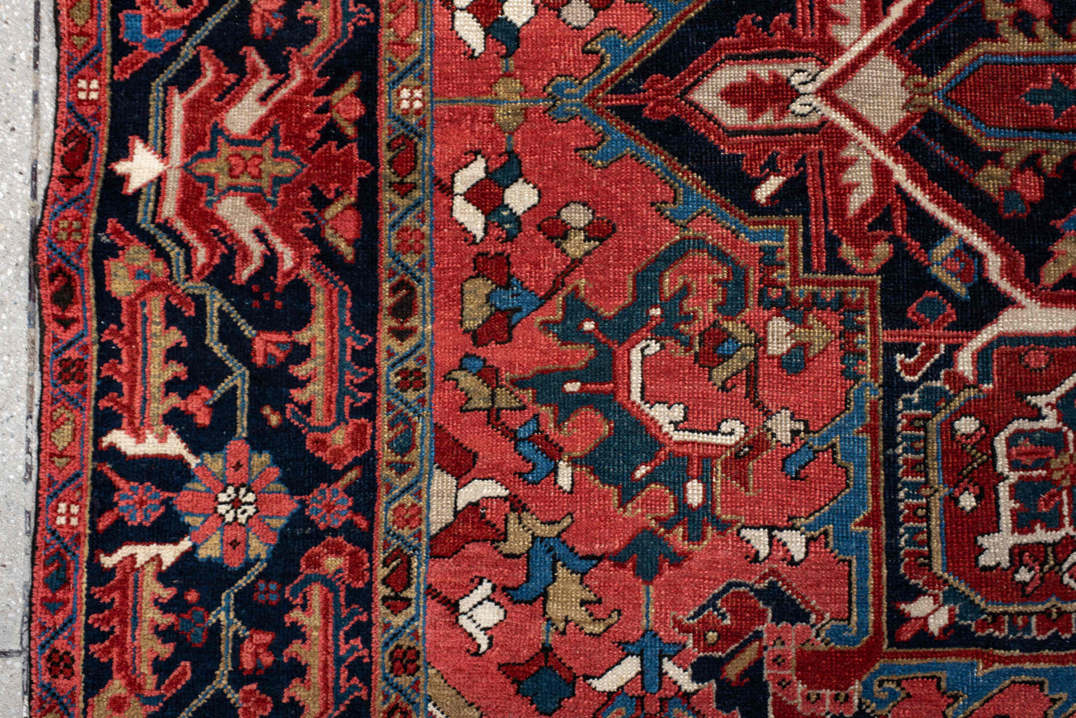 7' x 11' one-of-a-kind handmade antique Heriz large size rug. Color palette: rust, navy, sky_blue, ivory, brick, coral