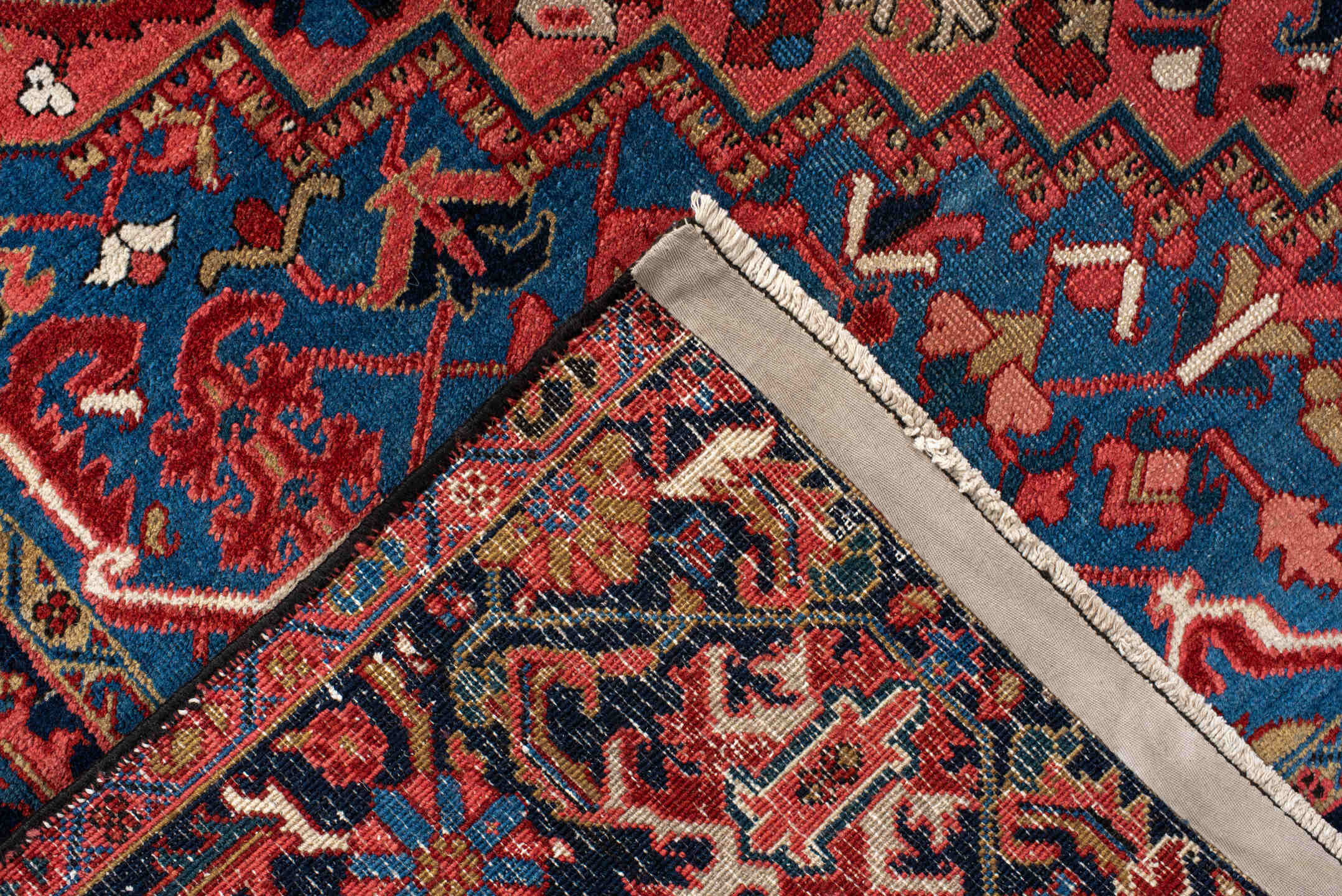 7' x 11' one-of-a-kind handmade antique Heriz large size rug. Color palette: rust, navy, sky_blue, ivory, brick, coral