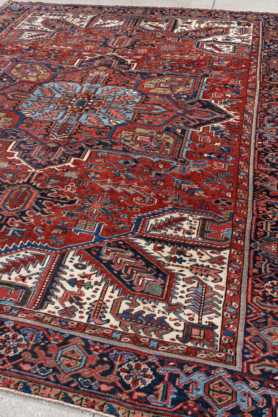 8' x 11' one-of-a-kind handmade antique Heriz large size rug. Color palette: rust, navy, ivory, sky blue, crimson, slate