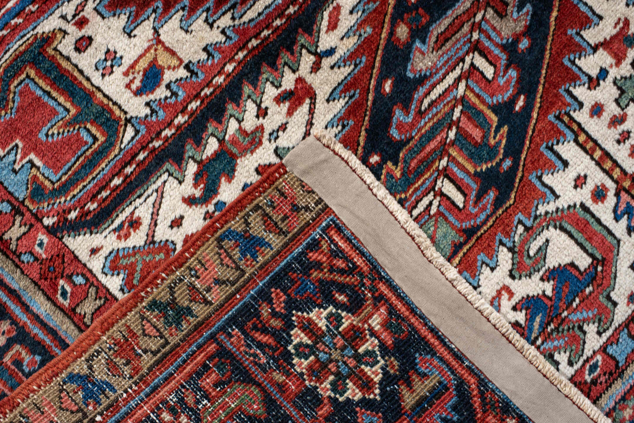 8' x 11' one-of-a-kind handmade antique Heriz large size rug. Color palette: rust, navy, ivory, sky blue, crimson, slate