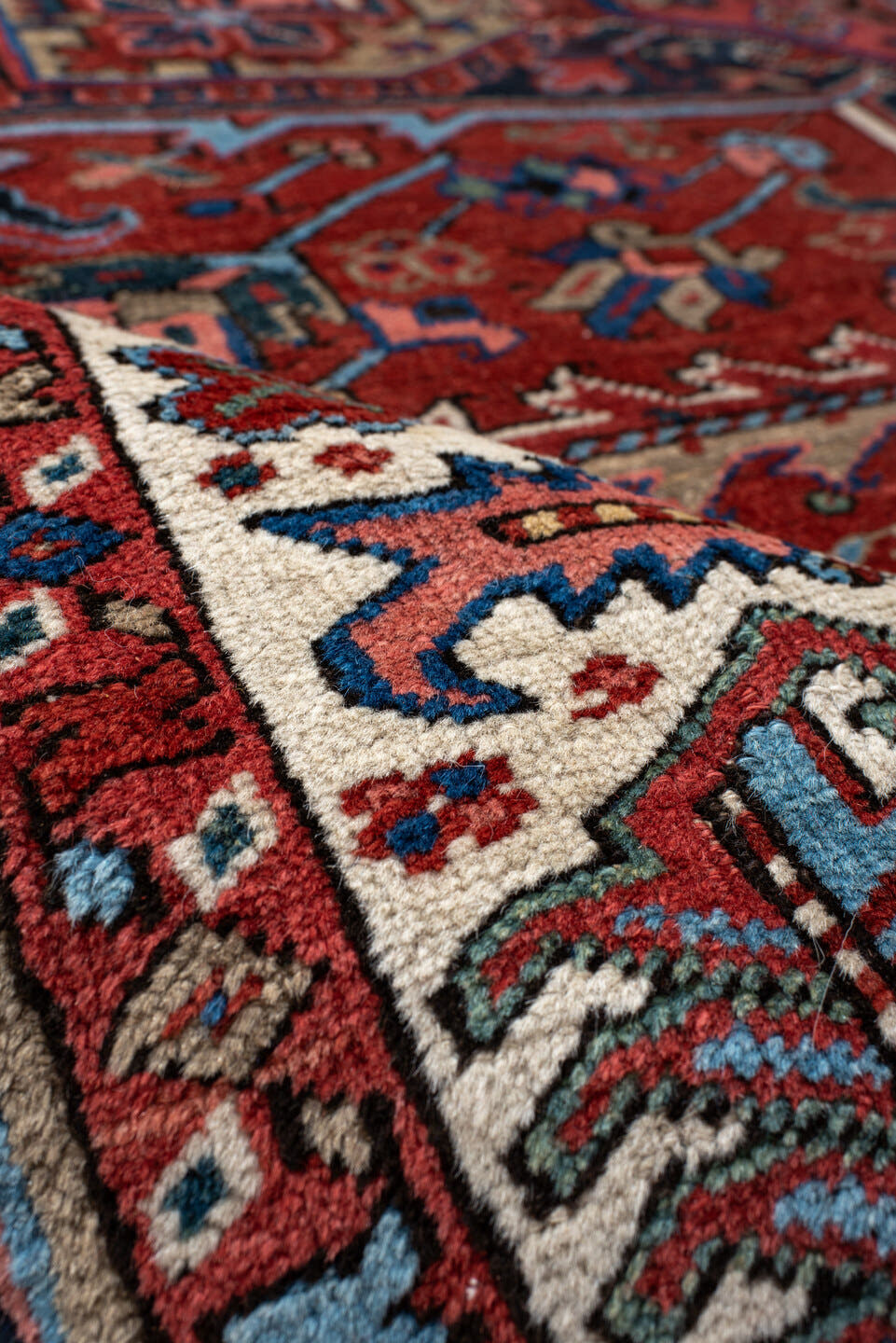 8' x 11' one-of-a-kind handmade antique Heriz large size rug. Color palette: rust, navy, ivory, sky blue, crimson, slate