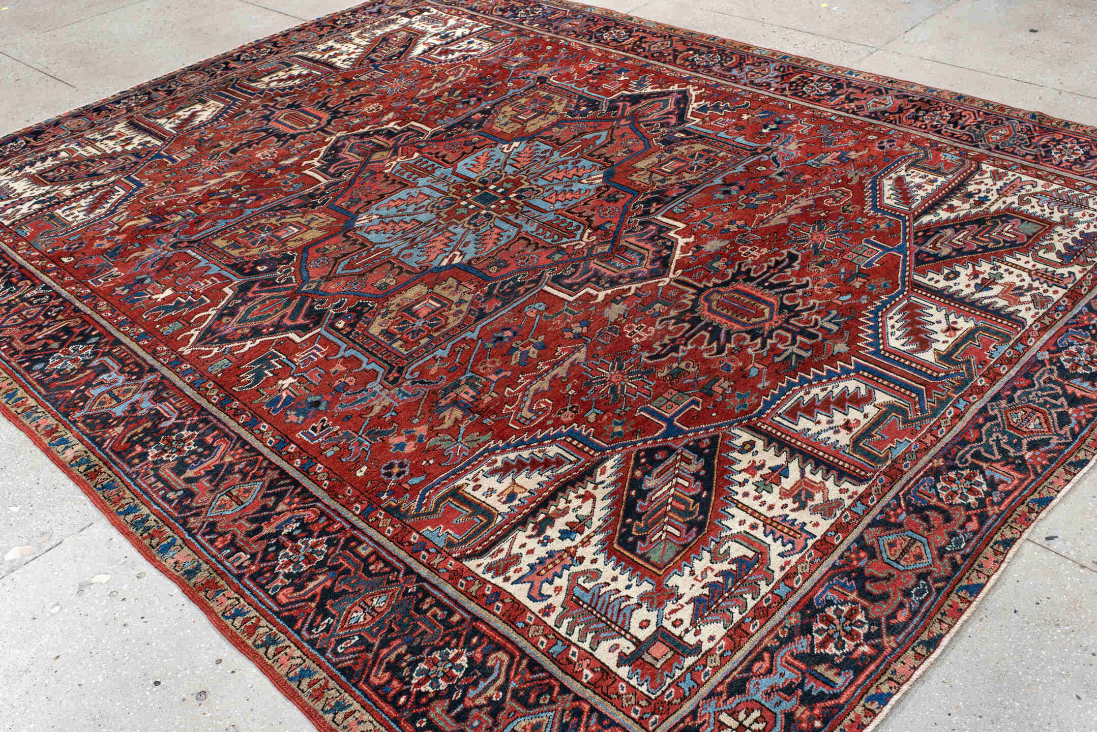 8' x 11' one-of-a-kind handmade antique Heriz large size rug. Color palette: rust, navy, ivory, sky blue, crimson, slate