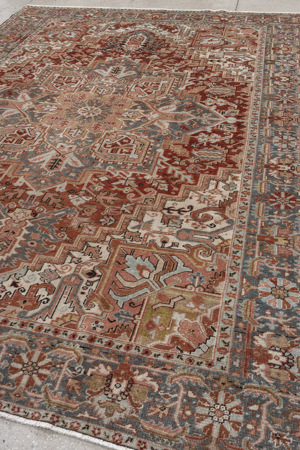 8' x 11' one-of-a-kind handmade vintage Heriz large size rug. Color palette: ivory, rust, steel blue, blush, taupe, brown