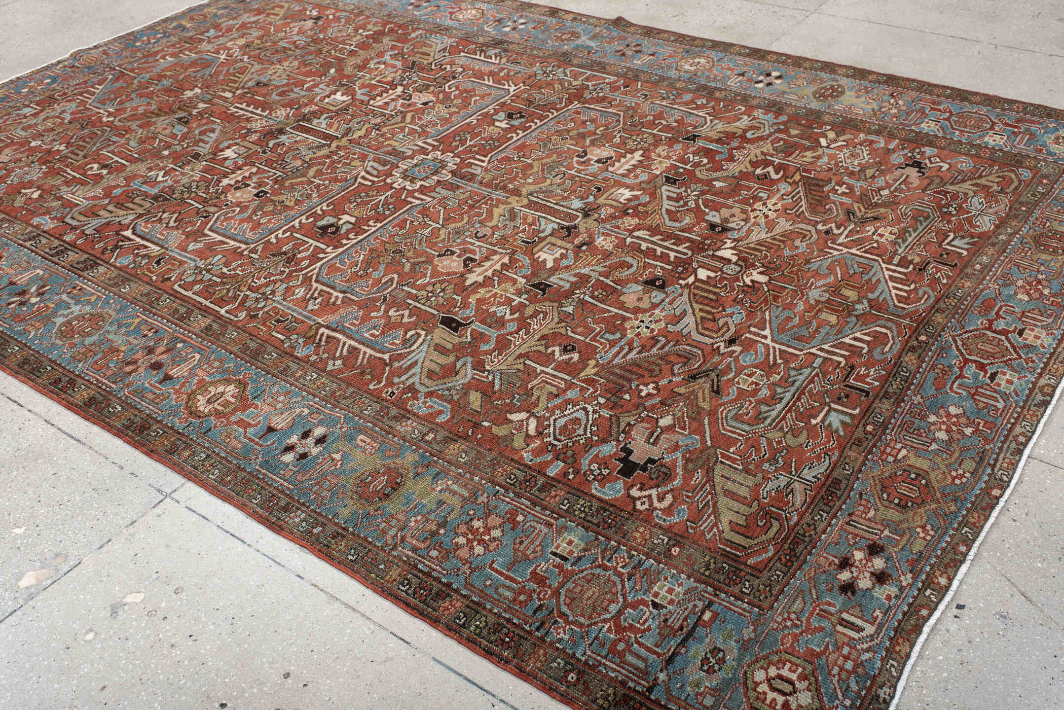 7' x 11' one-of-a-kind handmade antique Heriz large size rug. Color palette: rust, sky blue, ivory, taupe, charcoal, camel