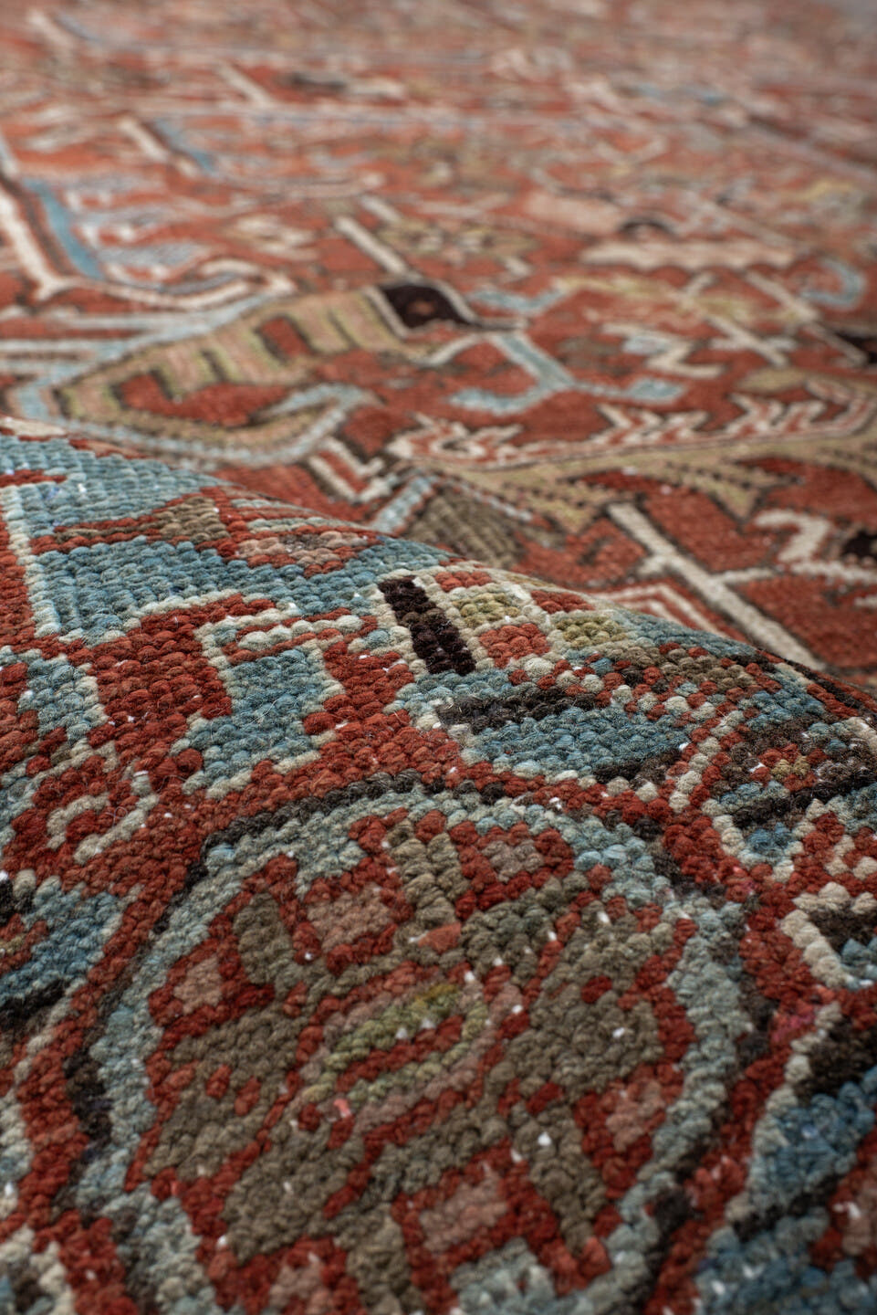 7' x 11' one-of-a-kind handmade antique Heriz large size rug. Color palette: rust, sky blue, ivory, taupe, charcoal, camel